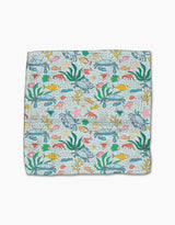 The Mindfulnice Beneath the Waves dishcloth set features a vibrant underwater pattern of fish, seaweed, starfish, shells, and coral on light blue. Made from recycled materials for an eco-friendly clean.