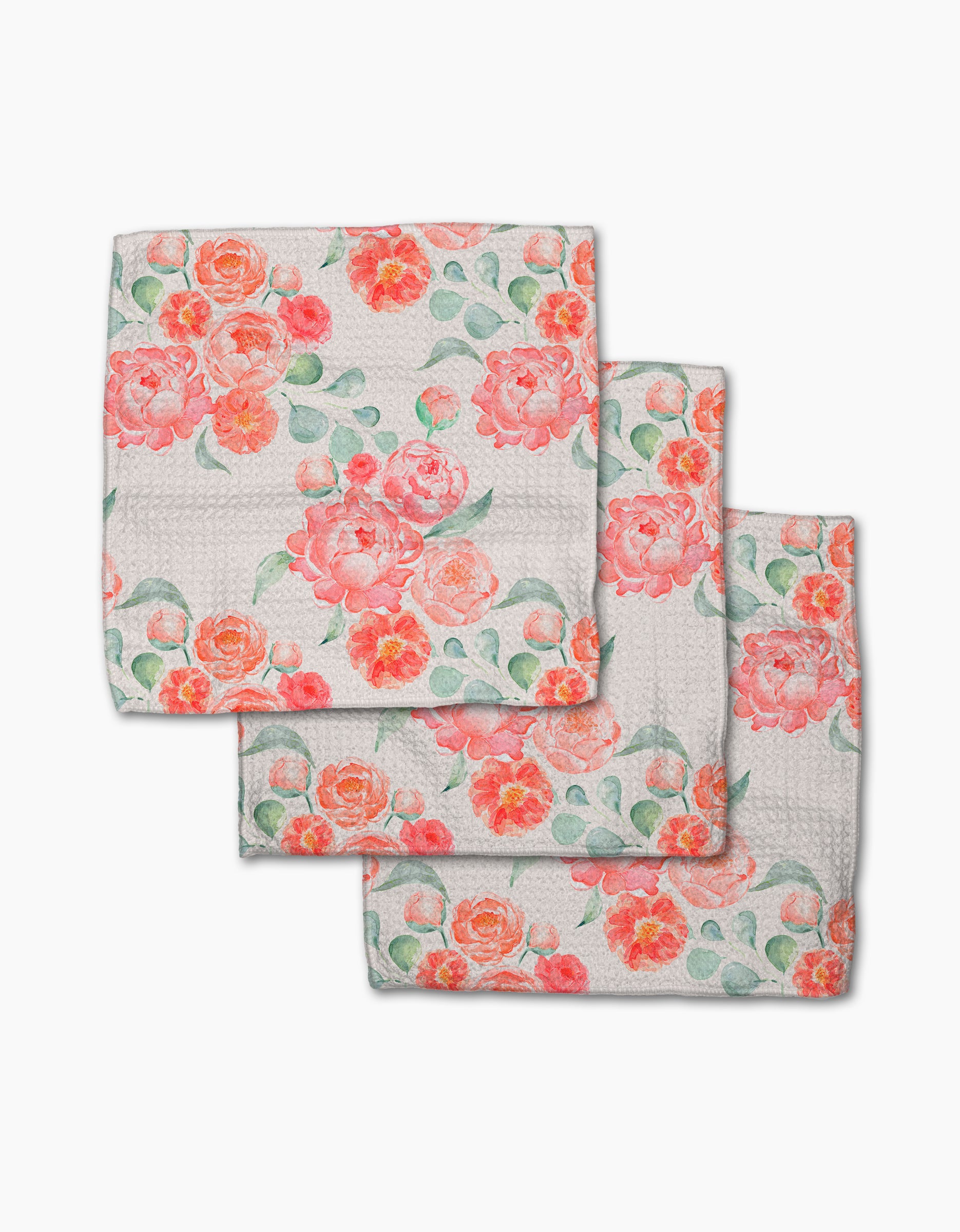 Three folded Elena Fay Blush Florals kitchen towels made from Geoweave fabric, each with a vibrant pink, orange, and coral floral print with green leaves. The dishcloths are stacked in an overlapping, charming display.