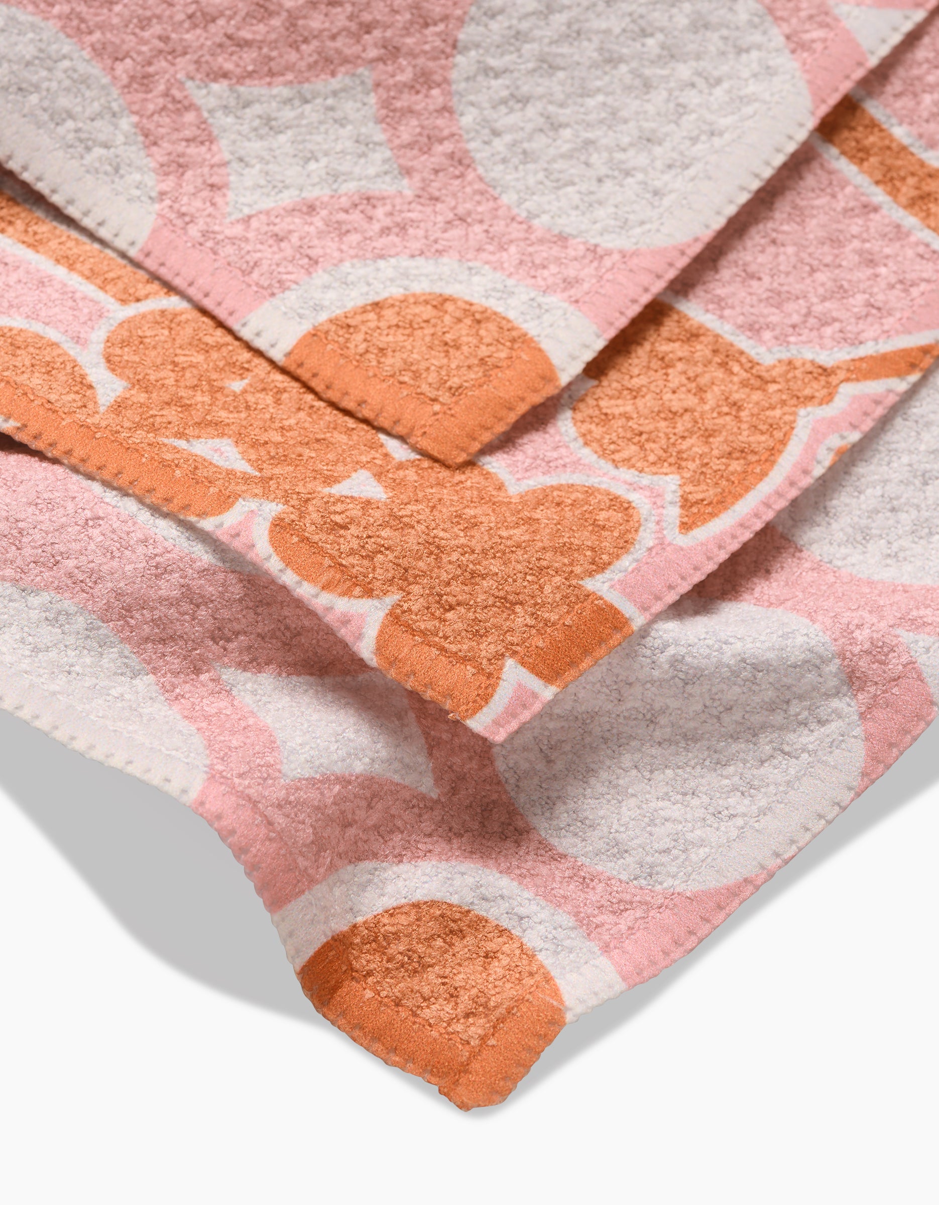 A close-up of Lizzie Clarks Bouncing Balls showcases vibrant patterns and textured surfaces, highlighting the playful design and overlapping details.