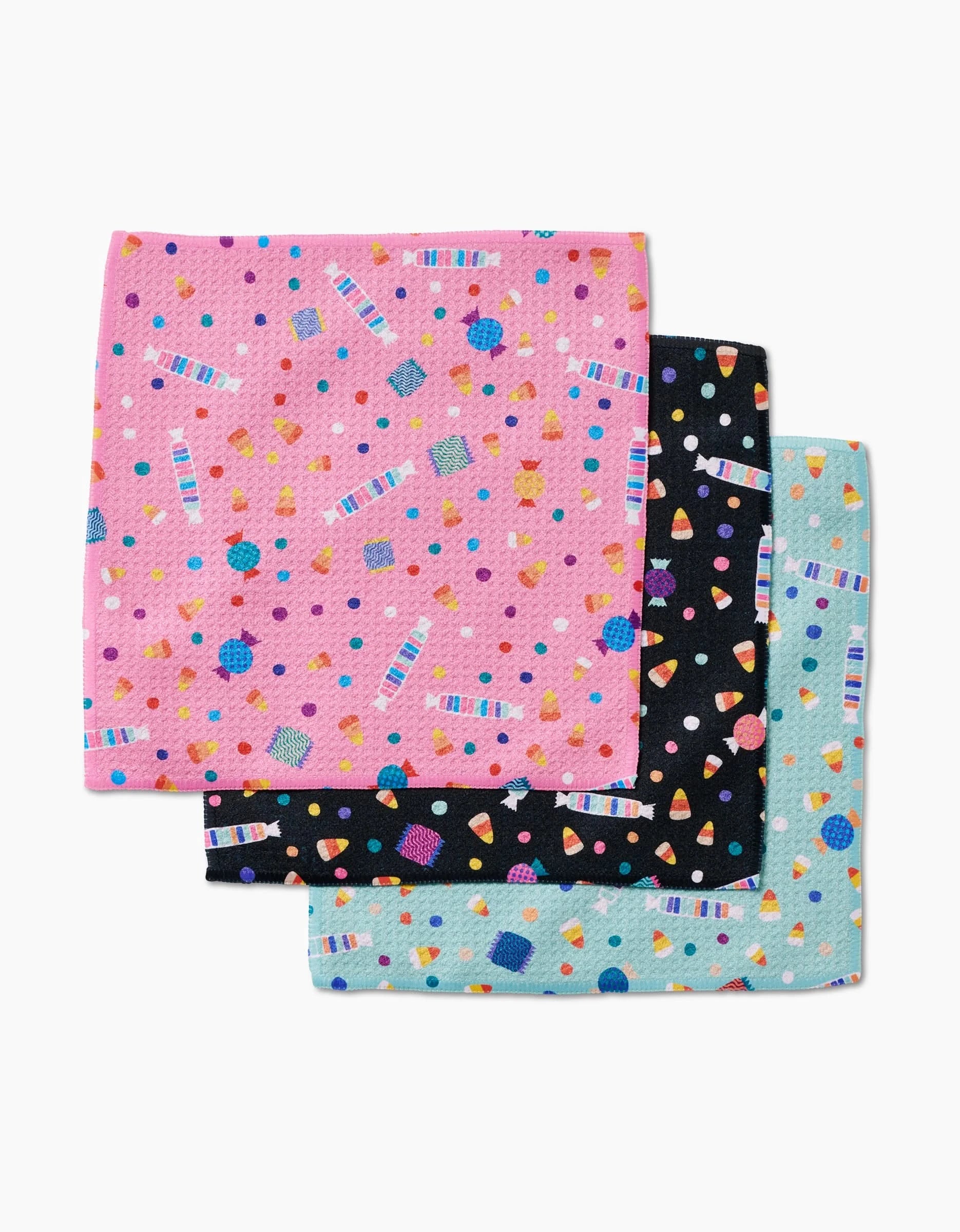 Three Candy Rush reusable dishcloths by Rebecca Bobko, made from eco-friendly Geoweave fabric, each with a vibrant terrazzo pattern: pink on top, black in the middle, and light blue on bottom.
