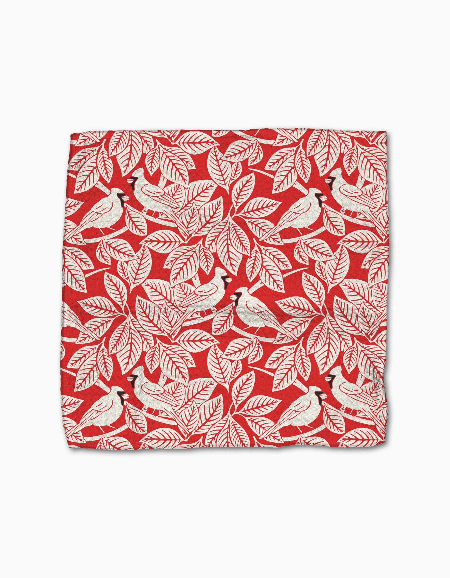 The Cardinal Canopy by Sarah Daugherty is a red handkerchief made from recycled materials, featuring a repeating pattern of white leaves and white birds with black crests.