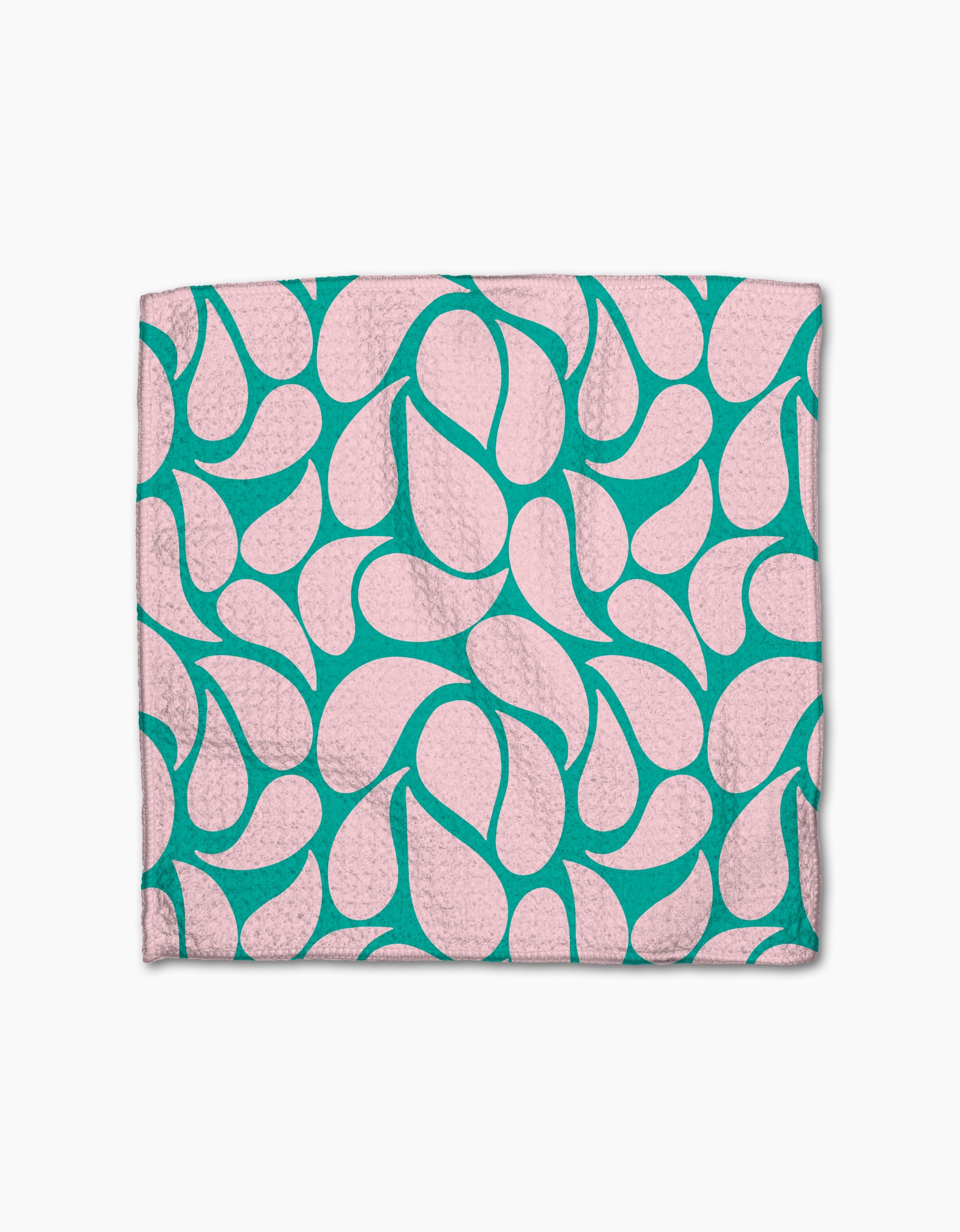The Cheetah Haven dishcloth set by Jasmine Blooms Designs features folded pink cloths with a teal abstract, teardrop-like pattern, crafted from recycled materials and shown on a white background.