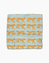 The Cheetah Haven dishcloth set by Jasmine Blooms Designs features light blue fabric with standing cheetahs in orange and black. Made from recycled materials, these super-absorbent towels bring style to any kitchen.