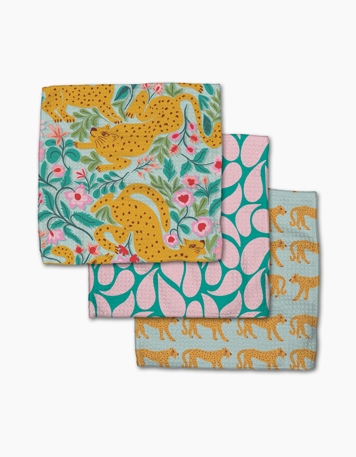 The Cheetah Haven dishcloth set by Jasmine Blooms Designs features three folded cloths with playful cheetah and floral prints, crafted from recycled materials for charming, eco-friendly style.