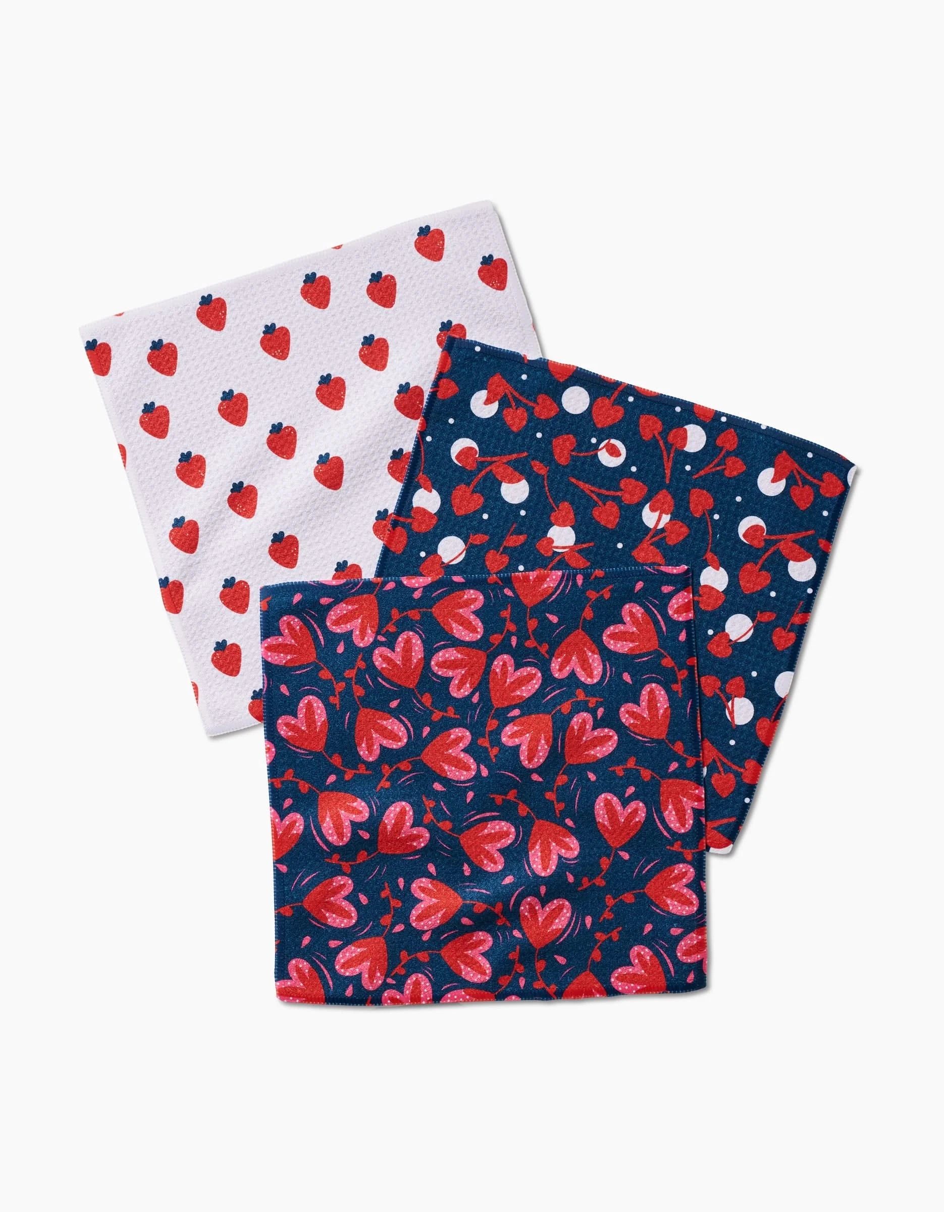 The Cherry Love napkin set by Charlie Rowan Designs features 3 stylish cloths made from recycled materials, each adorned with vibrant cherry prints—perfect for eco-friendly dishware or décor accents.