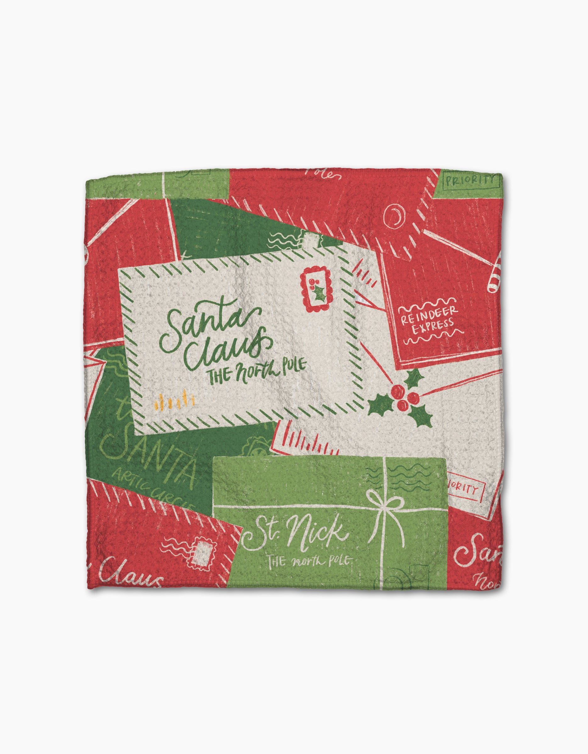 The Aubrey Fairchild Christmas Letter Pile dishcloth set features red and green envelopes marked Santa Claus, The North Pole, and St. Nick, plus holiday designs—crafted from recycled materials for sustainability.