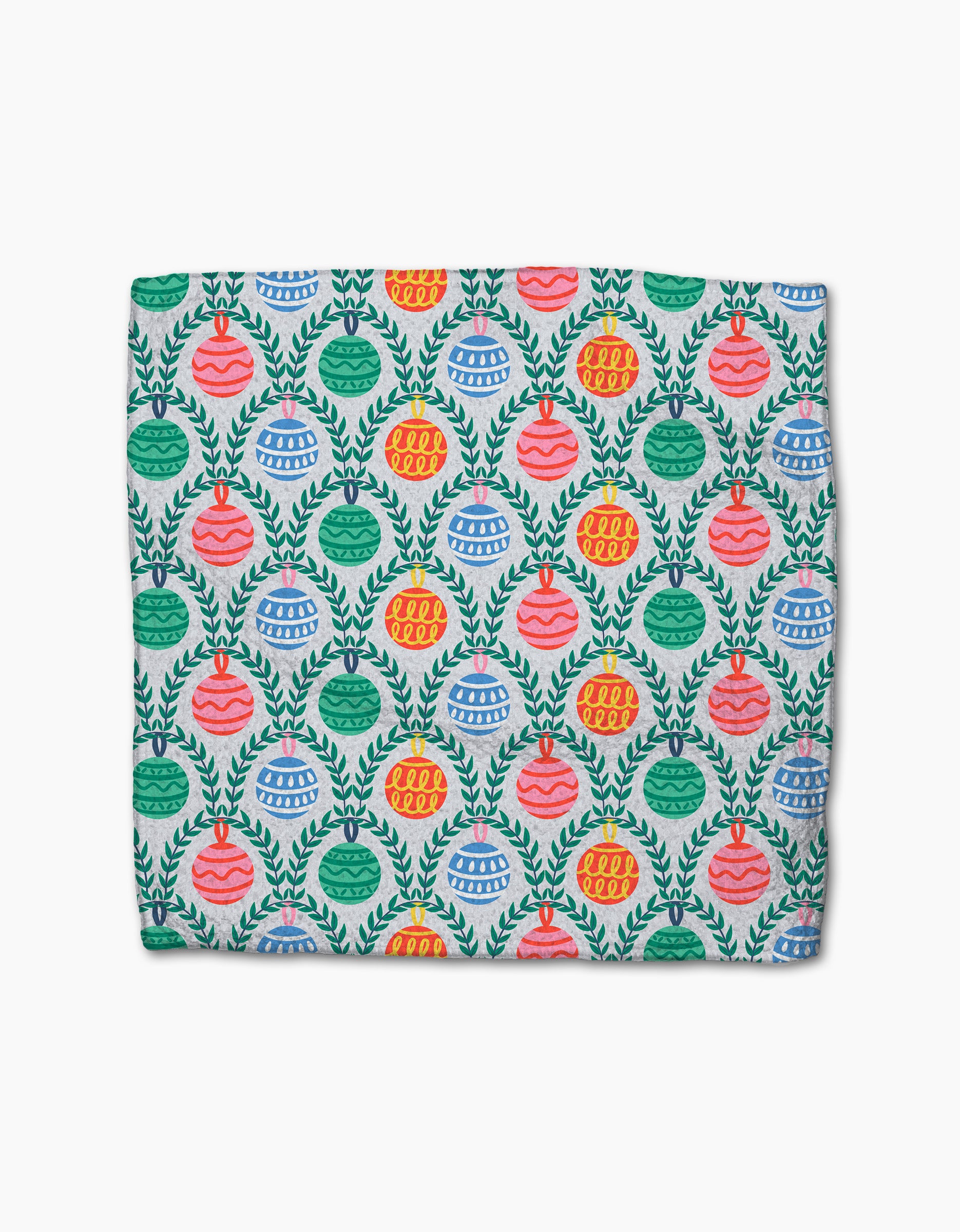 The Christmas Ornaments blanket by Ceyda Alasar is made from recycled materials and showcases a vibrant pattern of red, pink, blue, and green ornaments with green leaves on a white background.