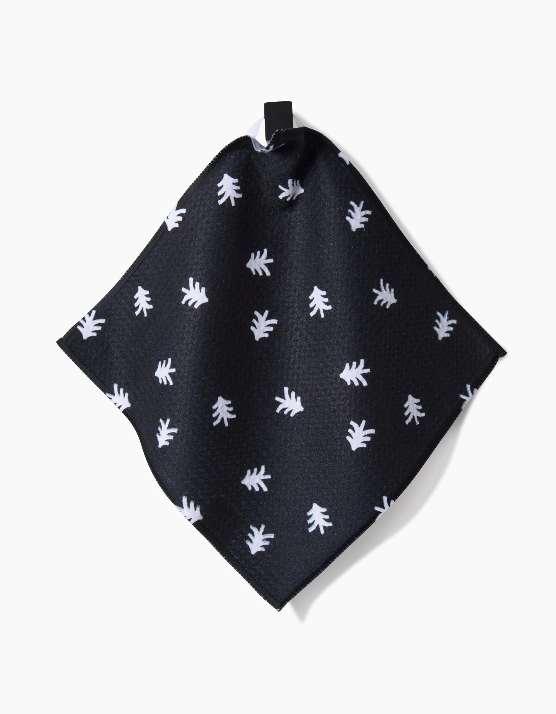 A black pocket square with small white fern-like leaf designs, presented on a white background—crafted for style, just like the Christmas Village by Coit Creative.