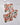 Three super-absorbent Geometry Cut Paper Leaves dishcloths, featuring colorful leaf and plant patterns in red, green, purple, and beige, are arranged on a white marble surface.