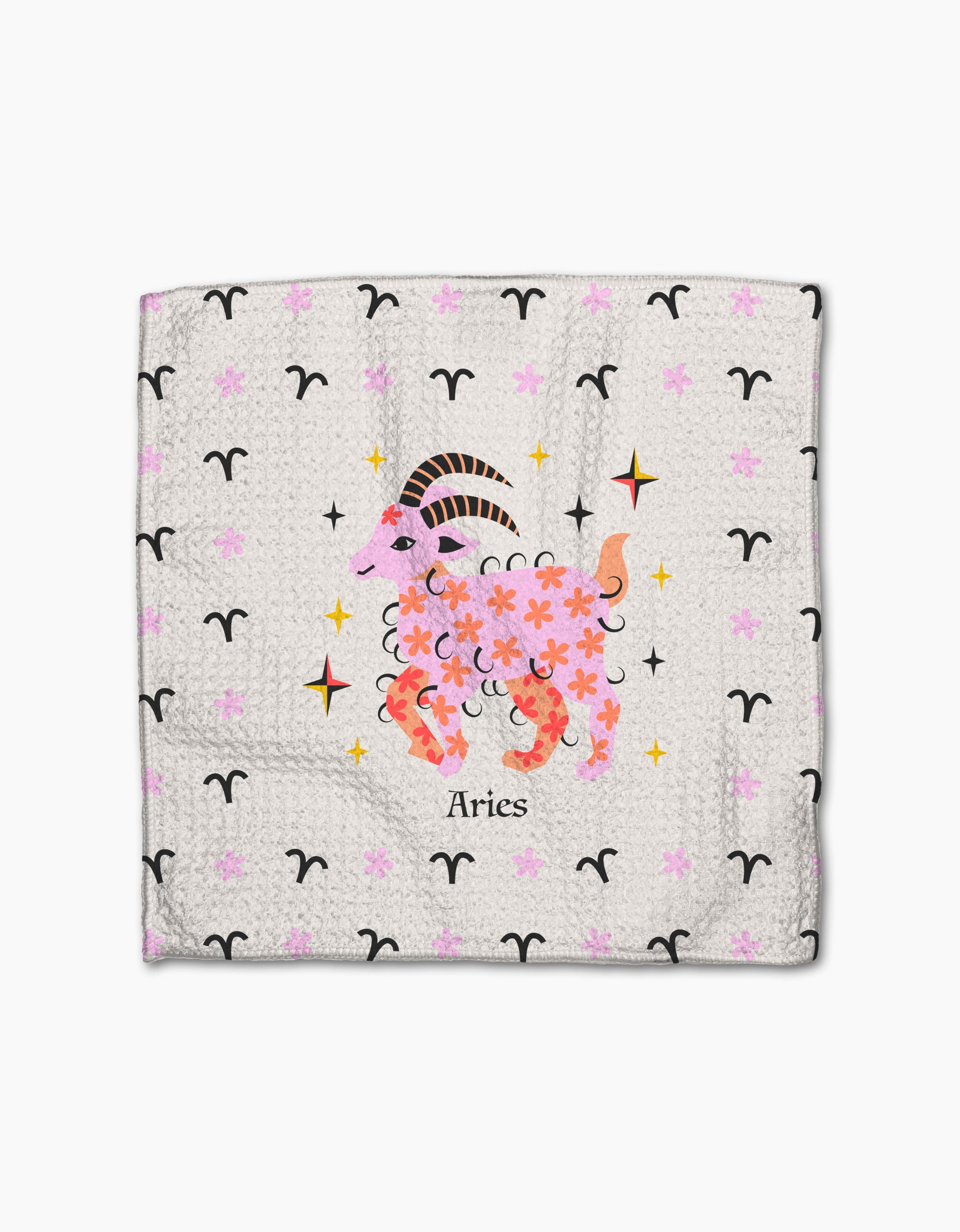 Heather Zhou's "Daring Aries" dishtowel features a whimsical Aries ram adorned with pink and purple flowers, zodiac symbols, and sparkles on a light background, with "Aries" written below.
