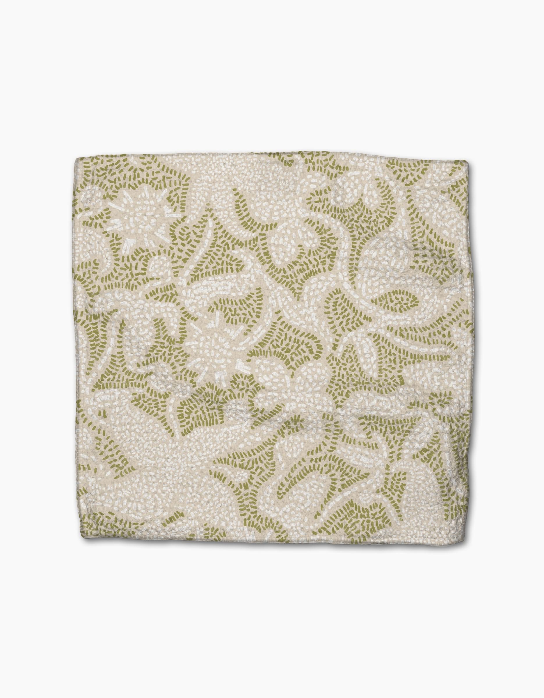 The Dotted Floral Garden by Geometry is a square fabric with a white background and intricate green and beige floral embroidery, crafted from recycled materials.