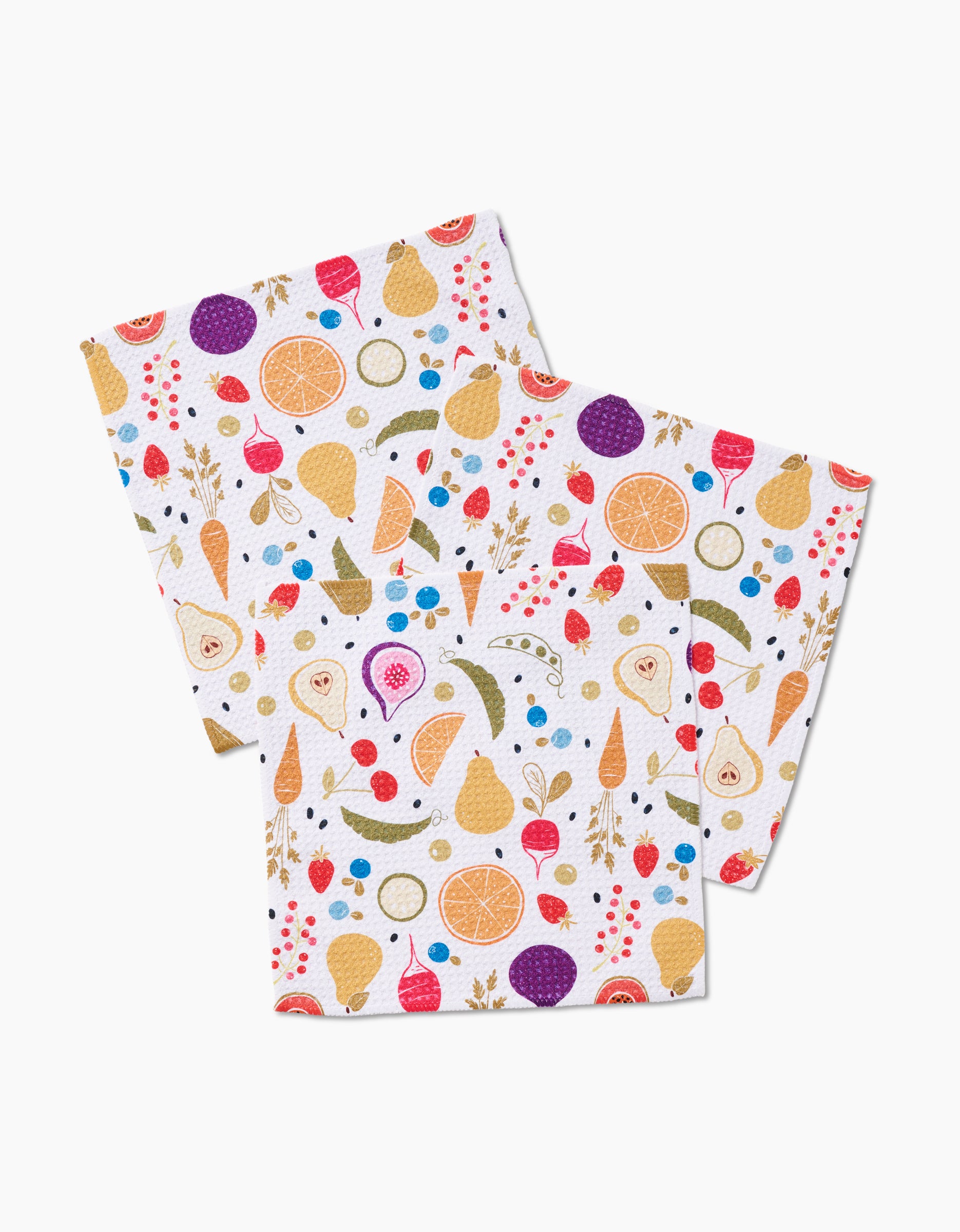 The Sara Mari Farmers Market set includes three white reusable dishcloths made from eco-friendly Geoweave fabric, featuring a vibrant fruit and vegetable pattern to brighten your kitchen.