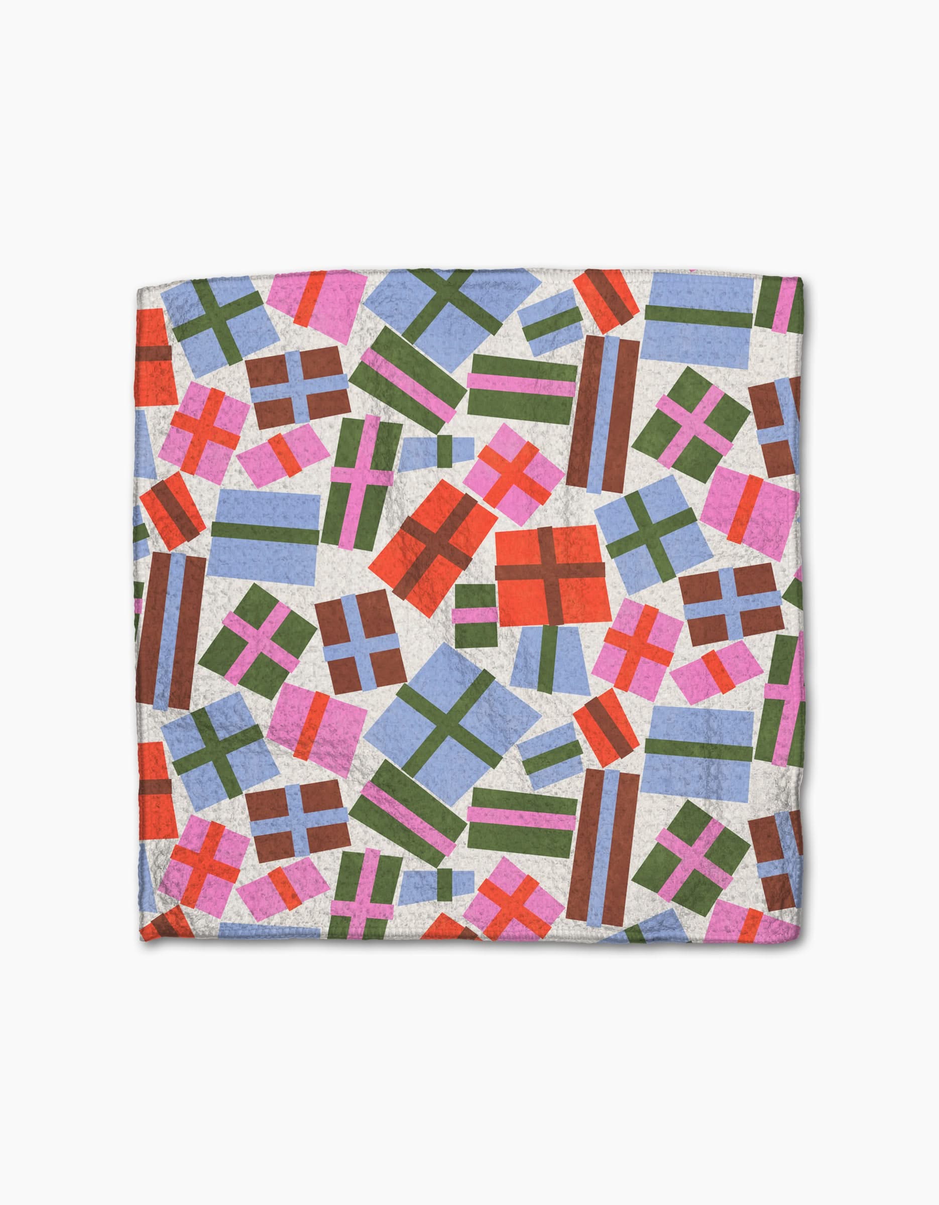 Claire Iglesias’ Festive Cheer napkin is made from recycled materials and features a vibrant print of red, green, blue, and pink gift boxes of various sizes on a white background.