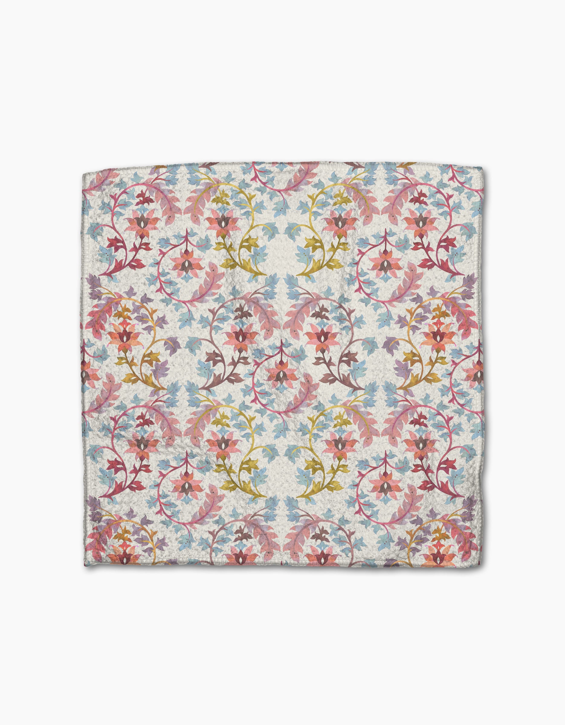 The Maayan Alper-Swan Folk Medallion is a square scarf with a vintage-inspired, symmetrical floral pattern in pink, blue, gold, and red on a light background, made from recycled materials with swirling vines and detailed leaves.