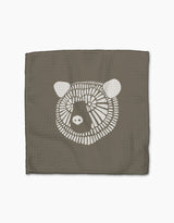 Forest Animals by Rosa Kichline: a square, textured brown recycled cloth with a simple white bear face illustration centered on a plain white background.