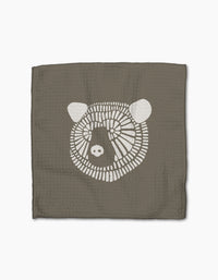Forest Animals by Rosa Kichline: a square, textured brown recycled cloth with a simple white bear face illustration centered on a plain white background.