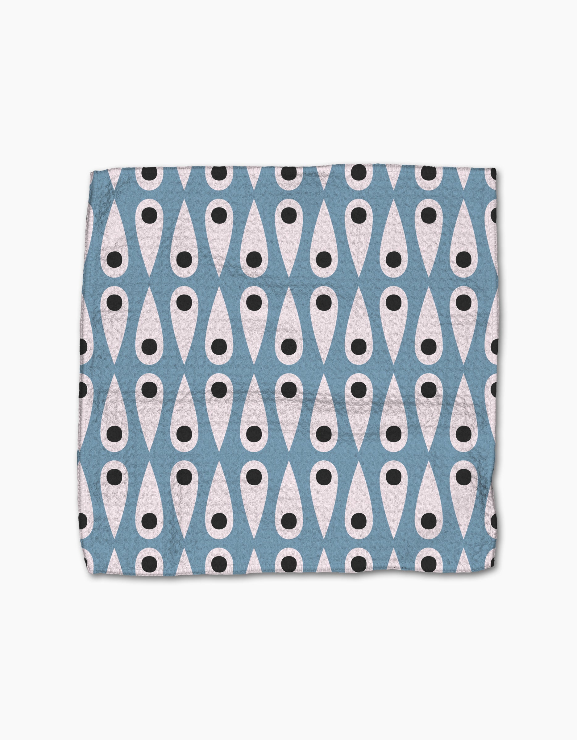 The Forest Findings dishcloth set by Anette Heiberg is made from recycled materials and features a bold geometric pattern of white ovals with black dots on a blue diamond background for an eye-catching look.