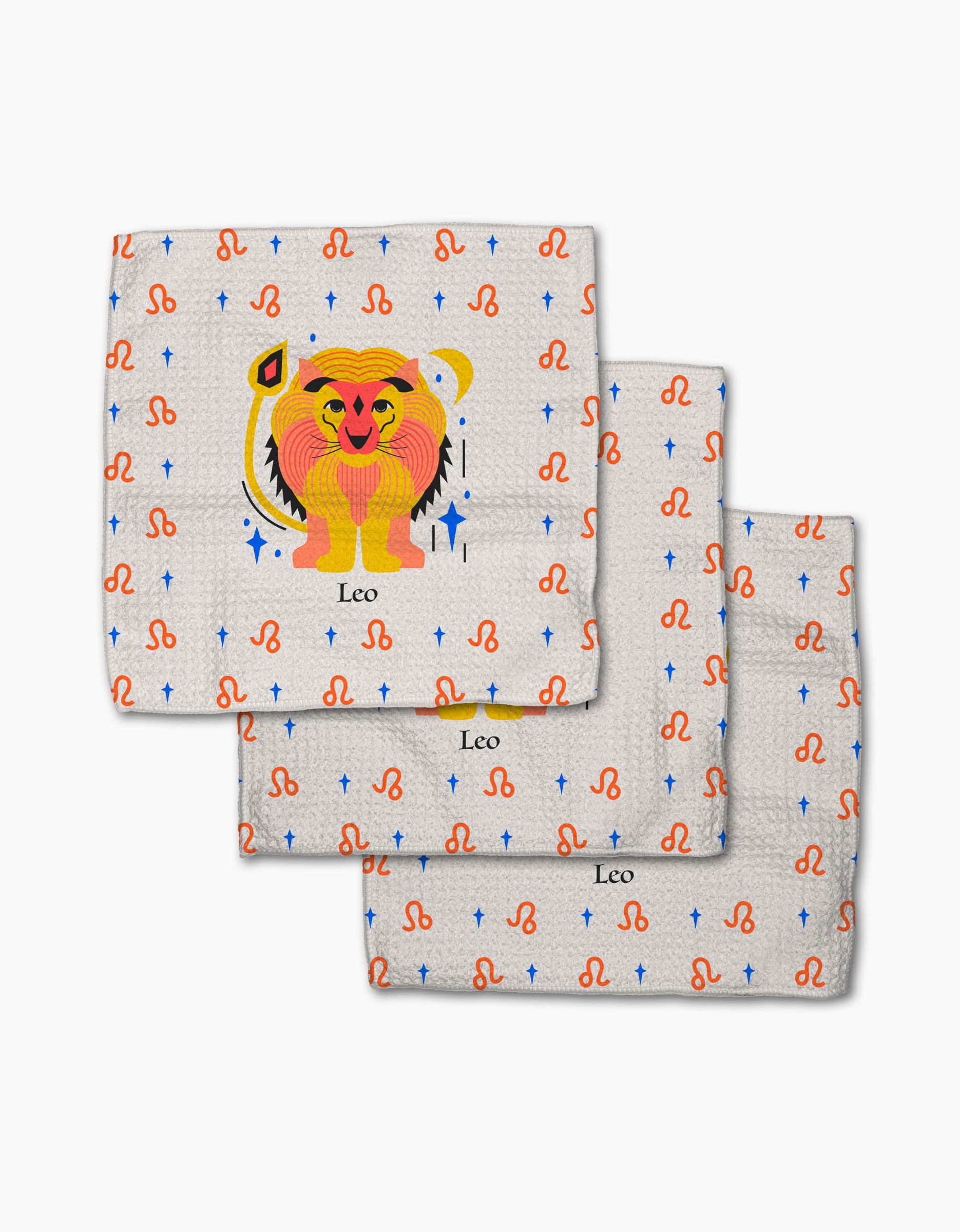The Glowing Leo dishcloth set by Heather Zhou includes three absorbent cloths with a cartoon lion, "Leo" text, orange zodiac symbols, and blue stars on a light background.