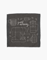 The Rosa Kichline Good Morning Coffee napkin is dark, made from recycled materials, with white line art of coffee mugs, a French press, espresso machine, beans, and good morning in cursive at the center.