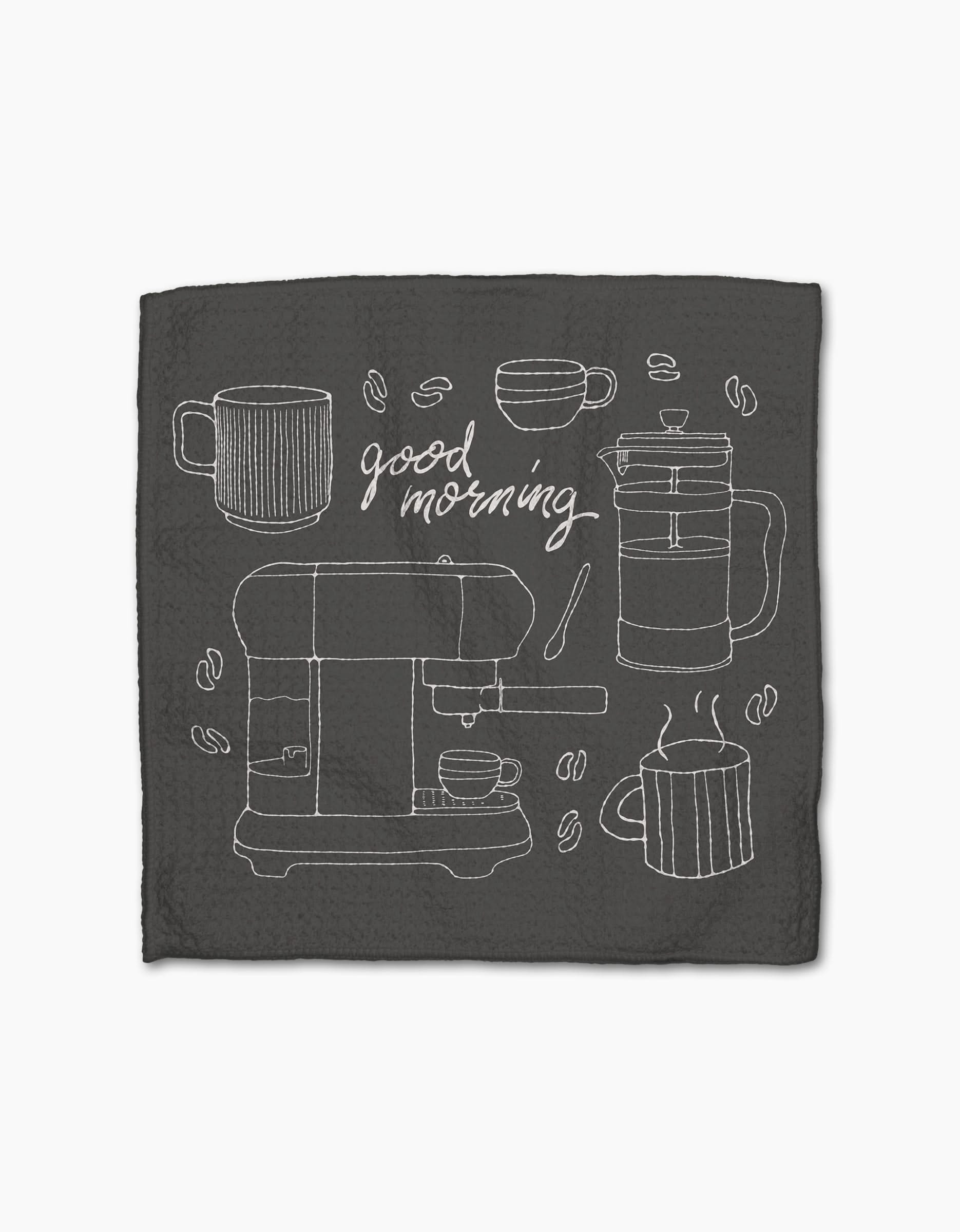 The Rosa Kichline Good Morning Coffee napkin is dark, made from recycled materials, with white line art of coffee mugs, a French press, espresso machine, beans, and good morning in cursive at the center.