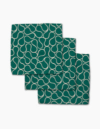 Three Green Loops cloth napkins by Gerdadzy, made from recycled materials, showcase a white abstract curvy line pattern and are neatly stacked on a white background.