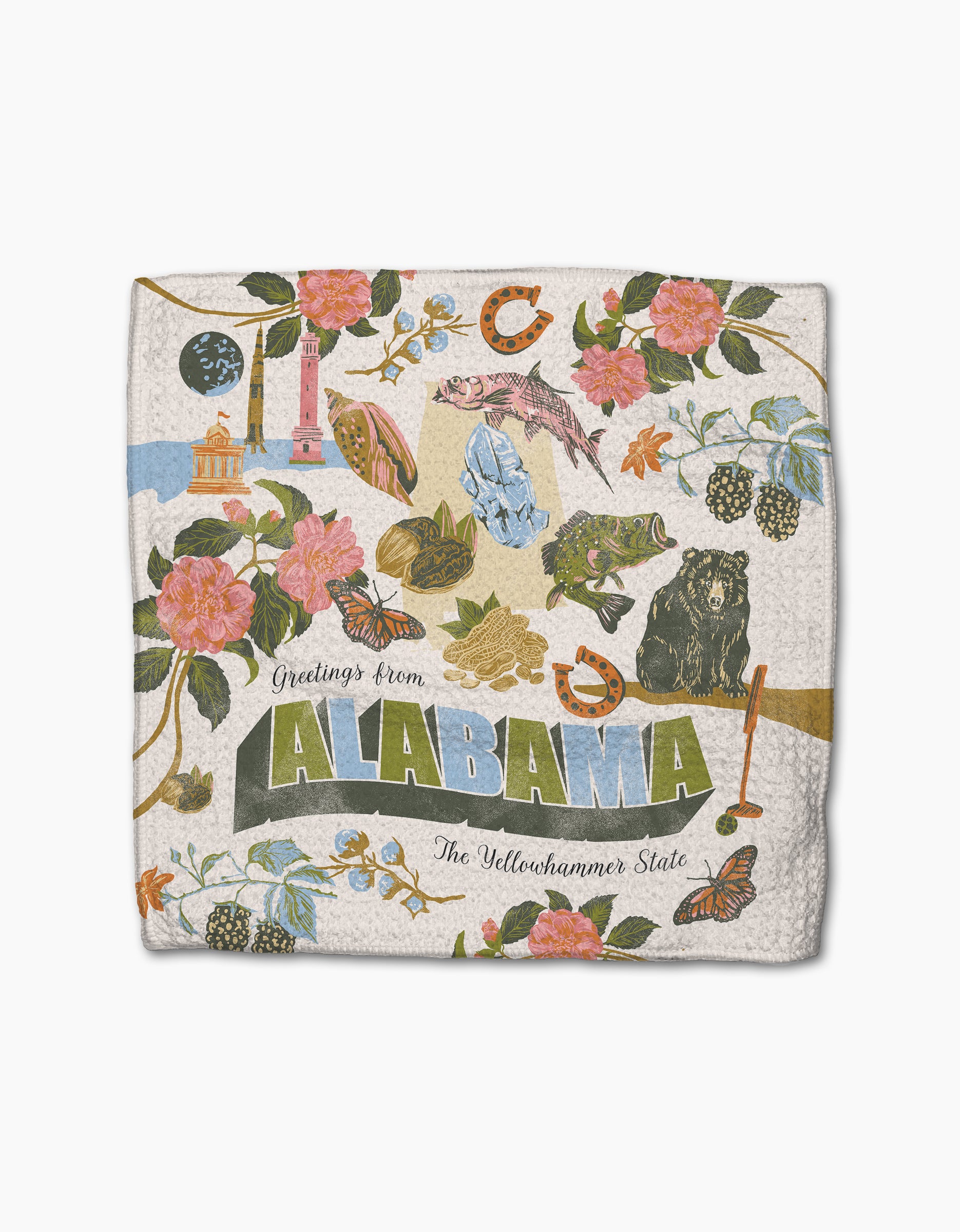 The Geometry "Greetings From Alabama" kitchen towel features “The Yellowhammer State” plus state symbols like flowers, a rocket, and more—a decorative and absorbent addition to any dishcloth set.