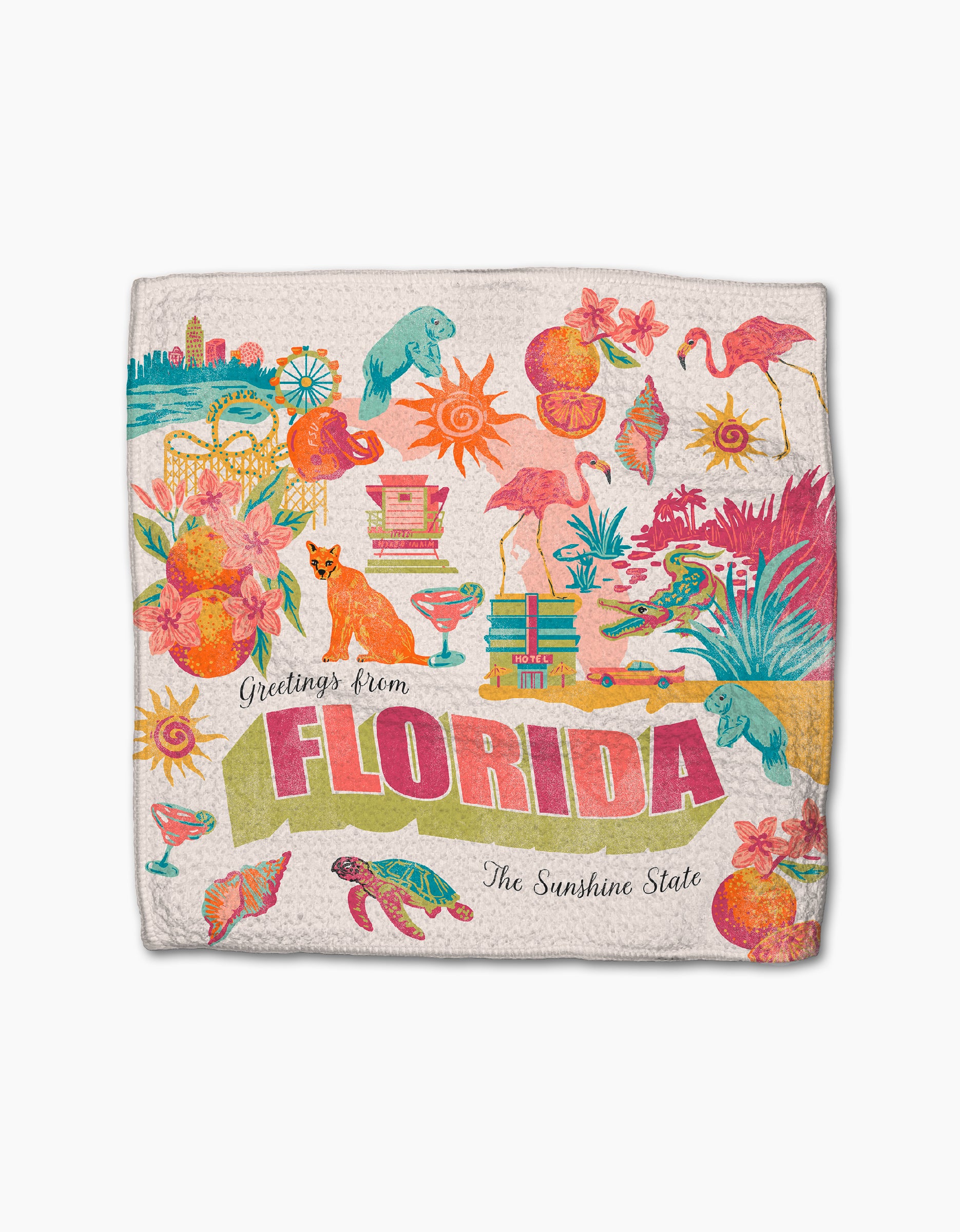 The Geometry "Greetings From Florida" kitchen towel is colorful and absorbent, featuring playful illustrations of flamingos, palm trees, oranges, beaches, turtles, and more with “Greetings from Florida, The Sunshine State” text.