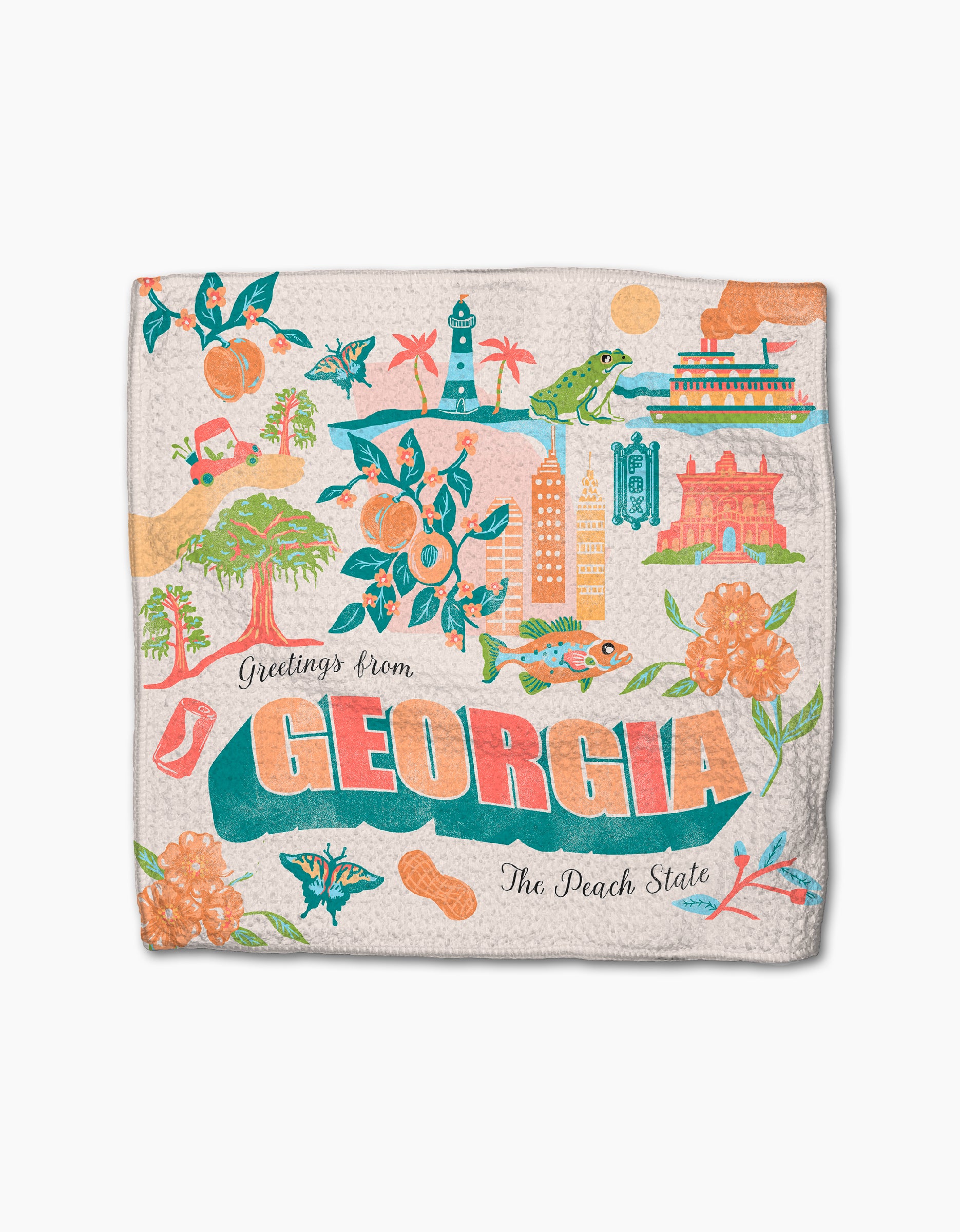 Geometry’s "Greetings From Georgia" recycled dishcloth features colorful illustrated landmarks, peaches, flowers, birds, and alligators with “Greetings from Georgia, The Peach State” in orange, teal, and green on a cream background.