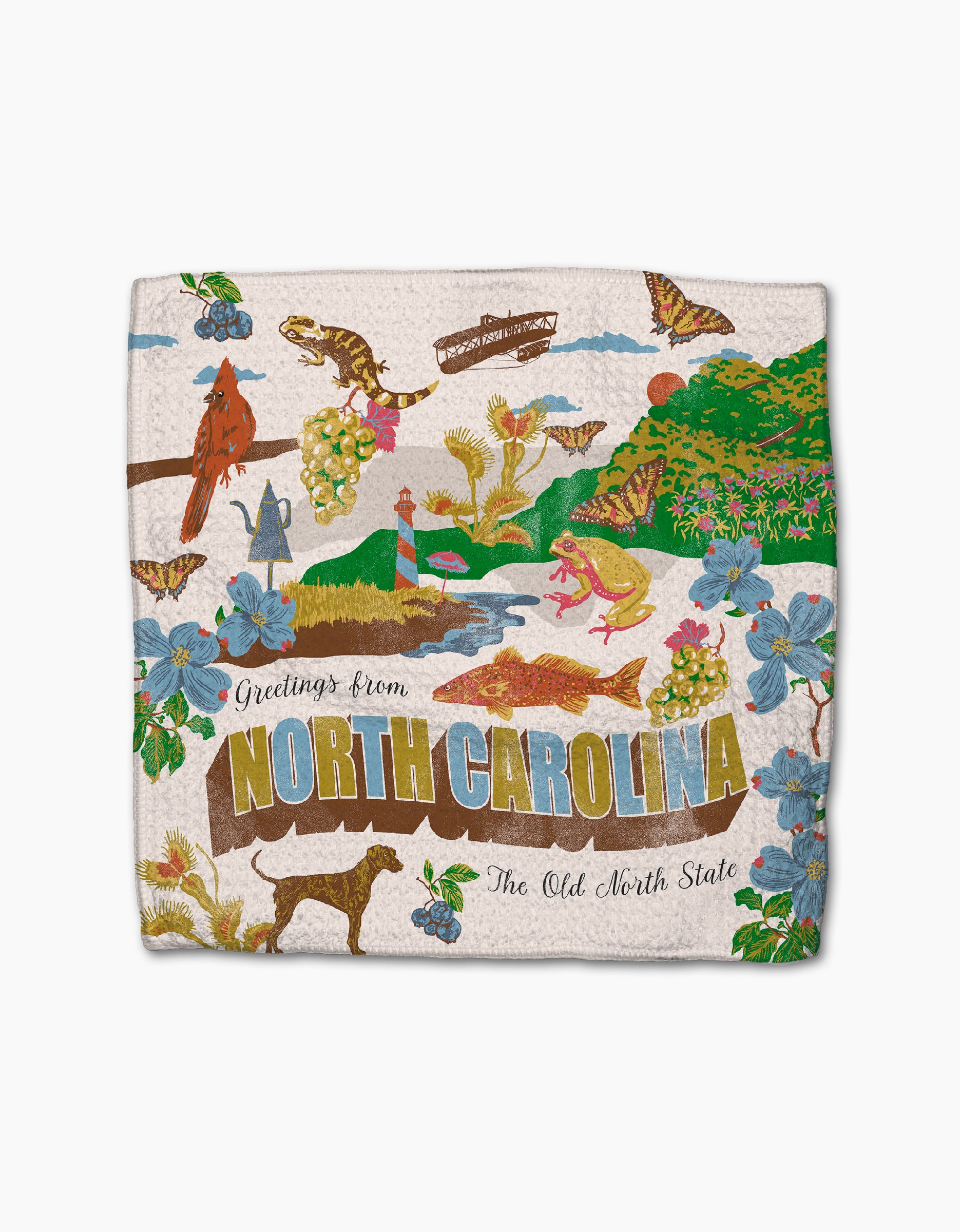 The "Greetings From North Carolina" dish towel by Geometry features vibrant NC symbols—cardinal, dogwood, lighthouses, and more—with "Greetings from North Carolina, The Old North State" printed on this absorbent, charming dishcloth.