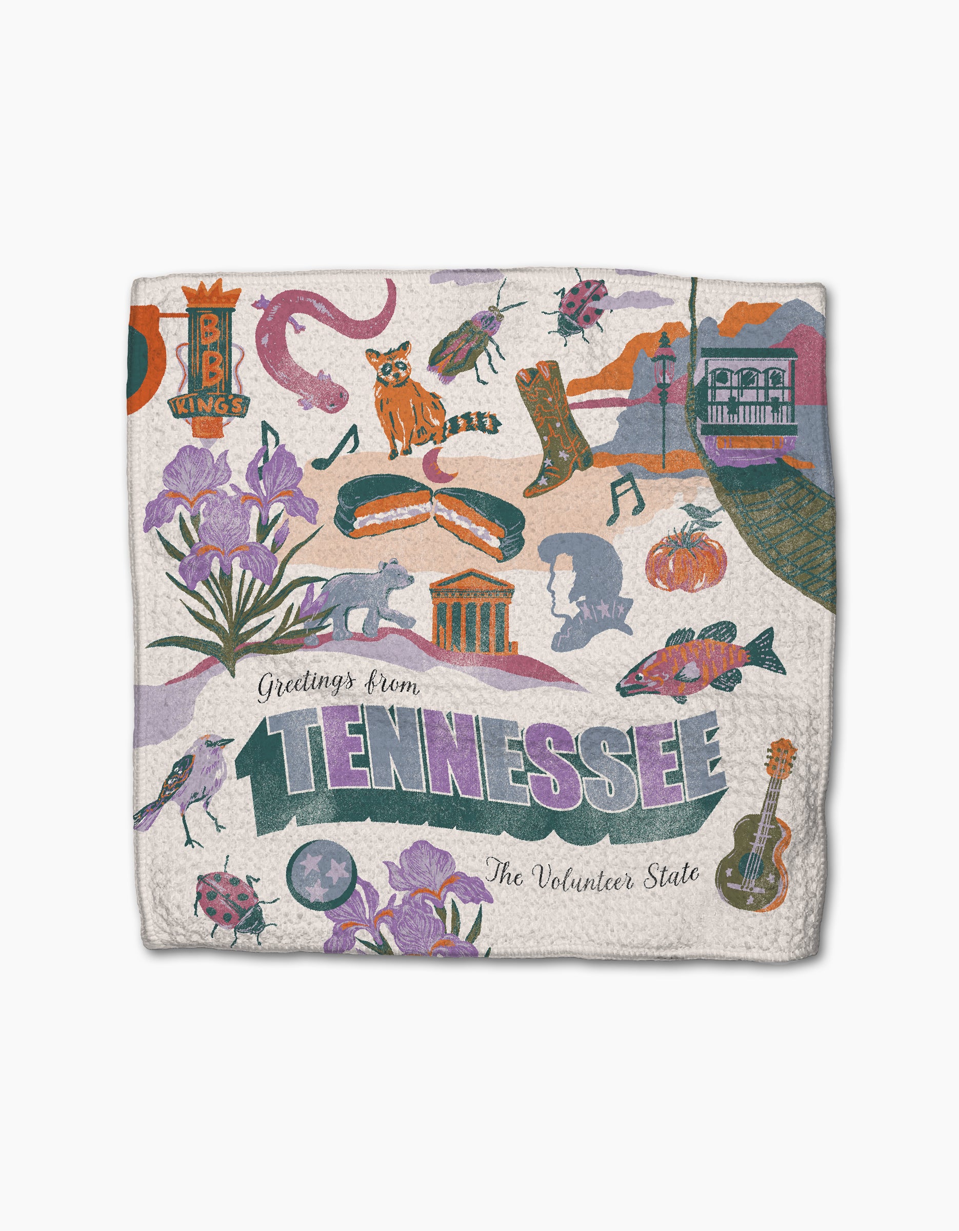 The Geometry Greetings From Tennessee blanket showcases colorful Tennessee icons—flowers, wildlife, BBQ, and Elvis—with “Greetings from Tennessee, The Volunteer State.” Pair with our absorbent dishcloths for a vibrant kitchen accent.