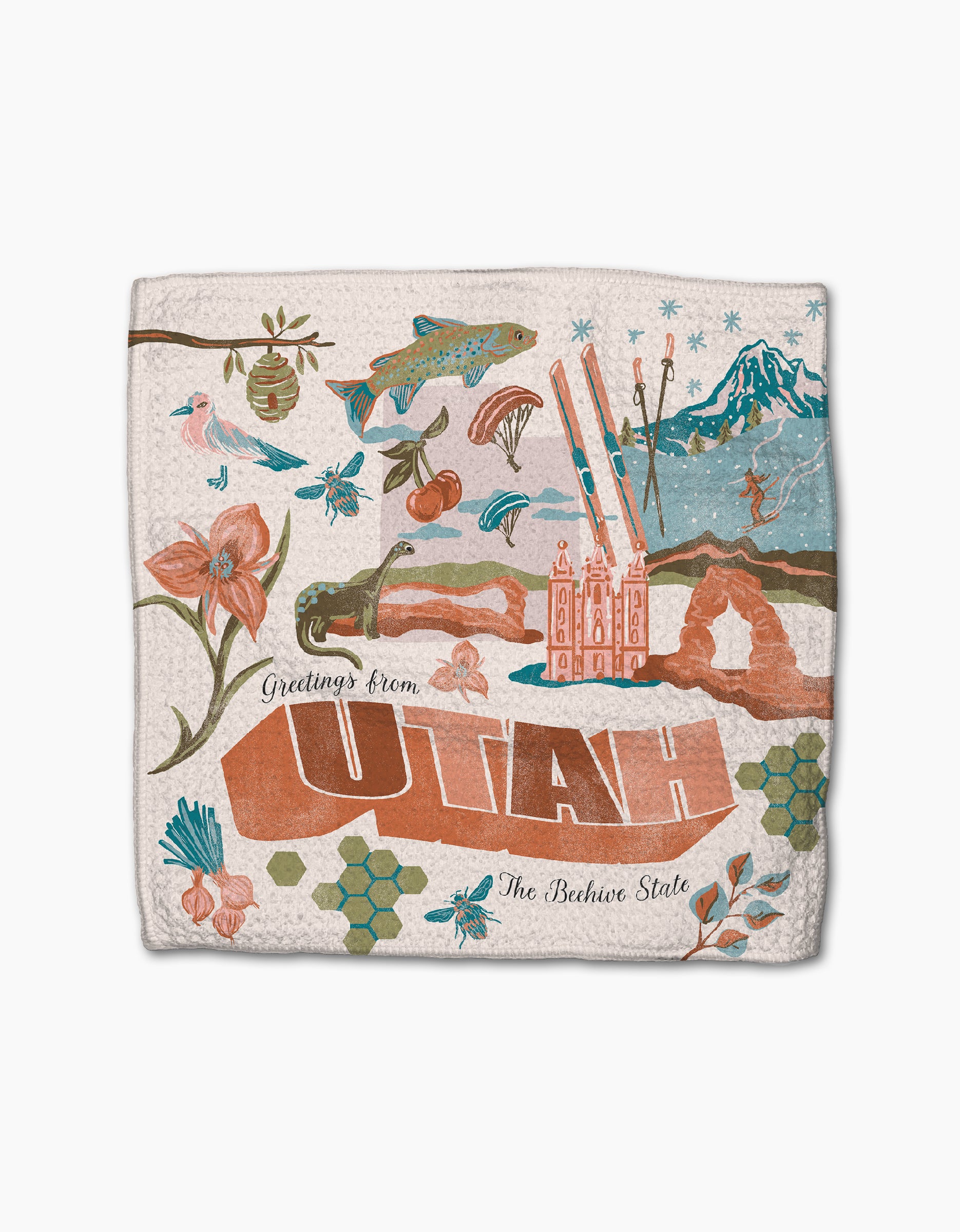 The Geometry "Greetings From Utah" decorative dishtowel showcases Utah icons like a beehive and Salt Lake Temple. Made from recycled materials, this super-absorbent towel reads: Greetings from UTAH, The Beehive State.
