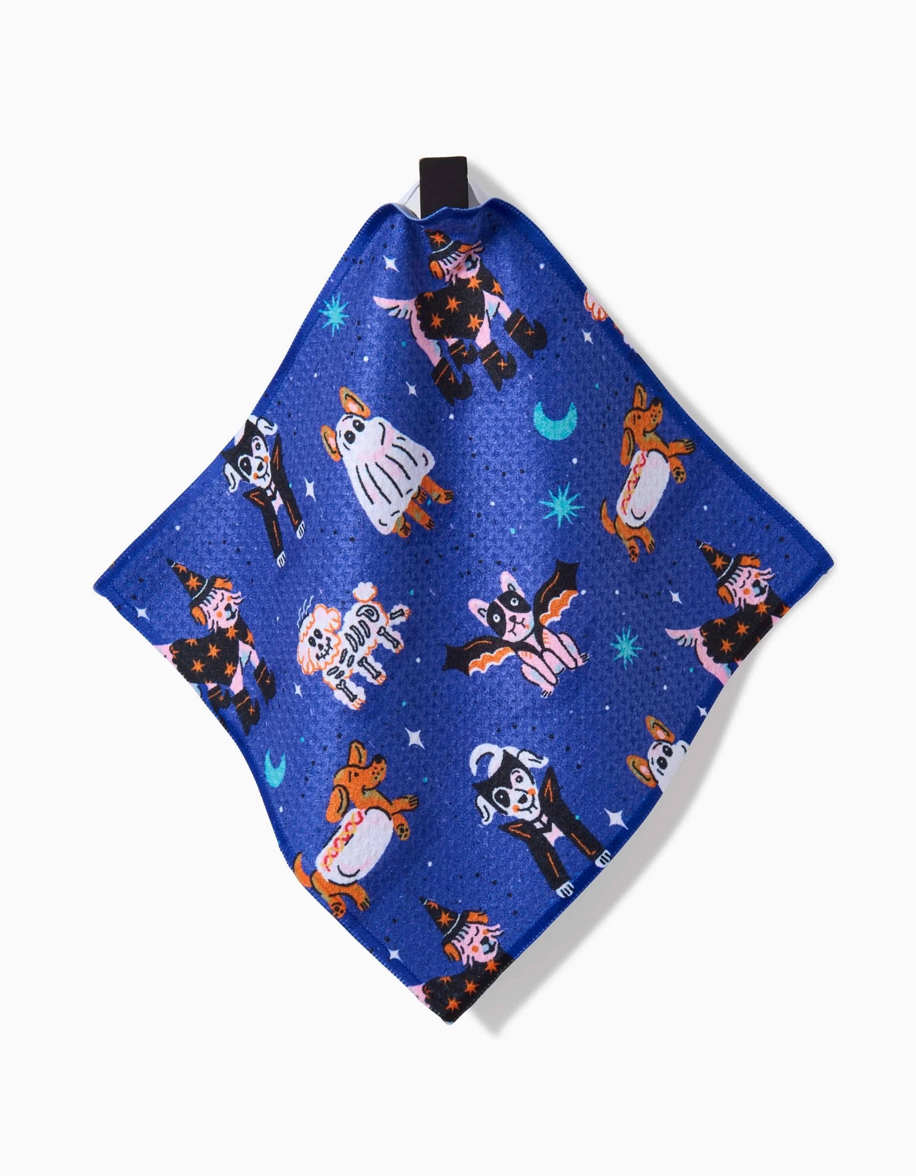 The Camila Leão Halloween Hounds dish towel is blue, super-absorbent, and features cartoon animals in Halloween costumes, with moons and stars on a white background.