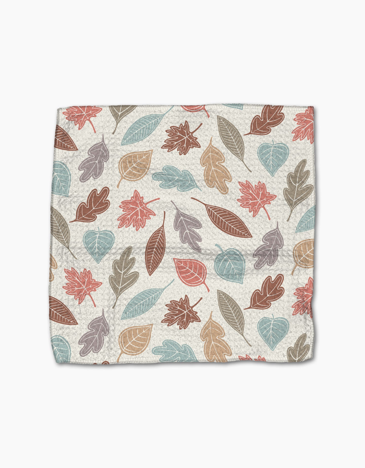 The Harvest Scatter by Sarah Daugherty is a square cloth made from recycled materials, featuring an autumn leaf pattern in muted red, orange, blue, and brown on a cream background.