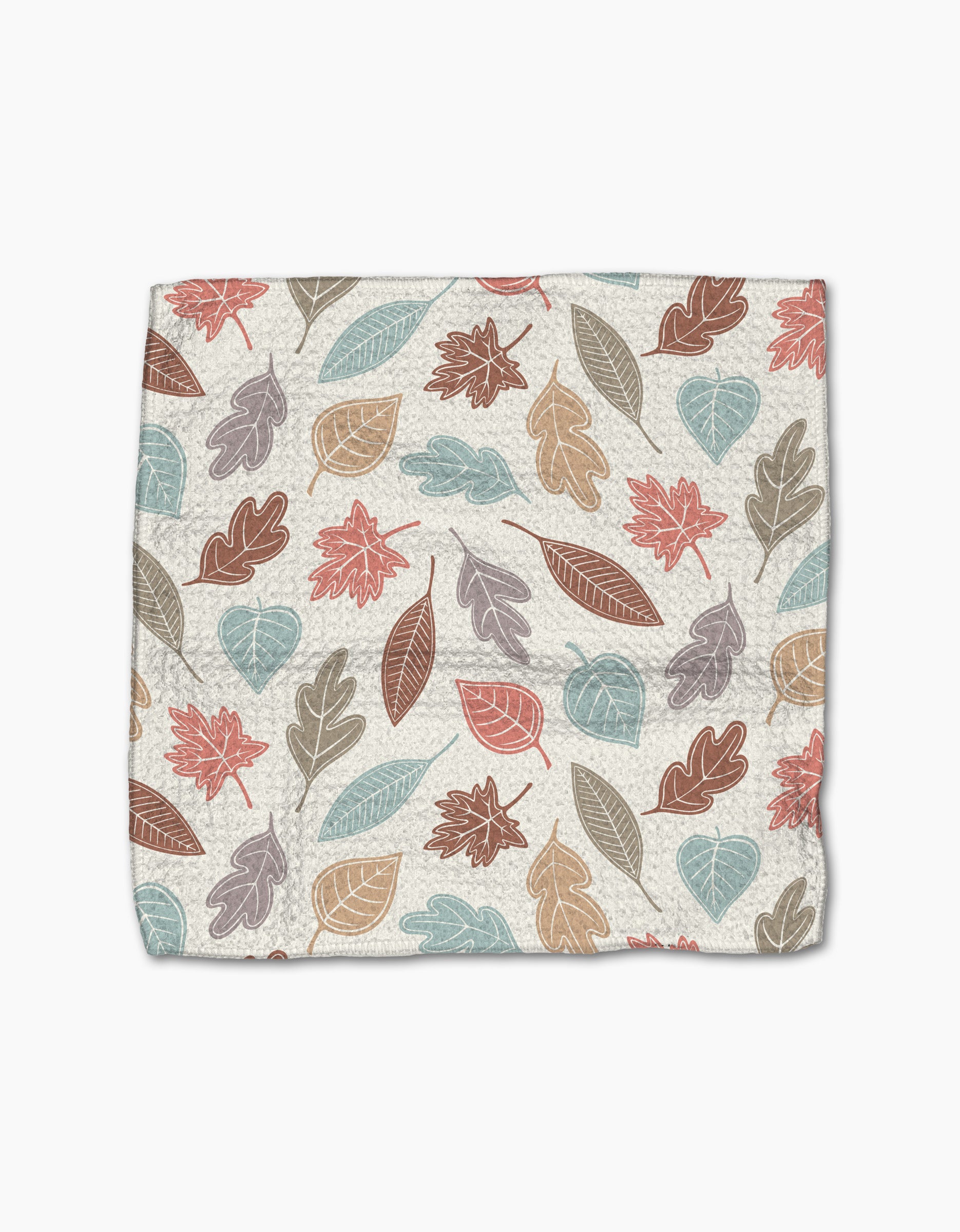 The Harvest Scatter by Sarah Daugherty is a square cloth made from recycled materials, featuring an autumn leaf pattern in muted red, orange, blue, and brown on a cream background.