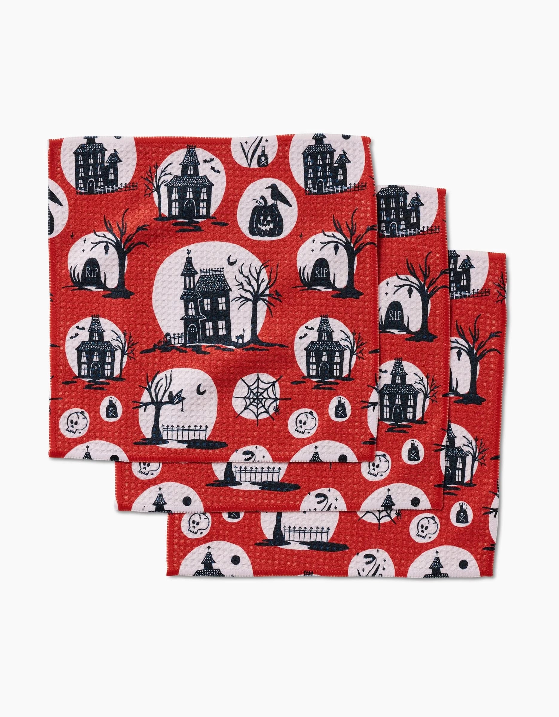 Kayla Anns Haunted House set includes three red, eco-friendly napkins made from recycled materials, each with Halloween designs: black haunted houses, trees, jack-o’-lanterns, ghosts, gravestones & webs in white circles.