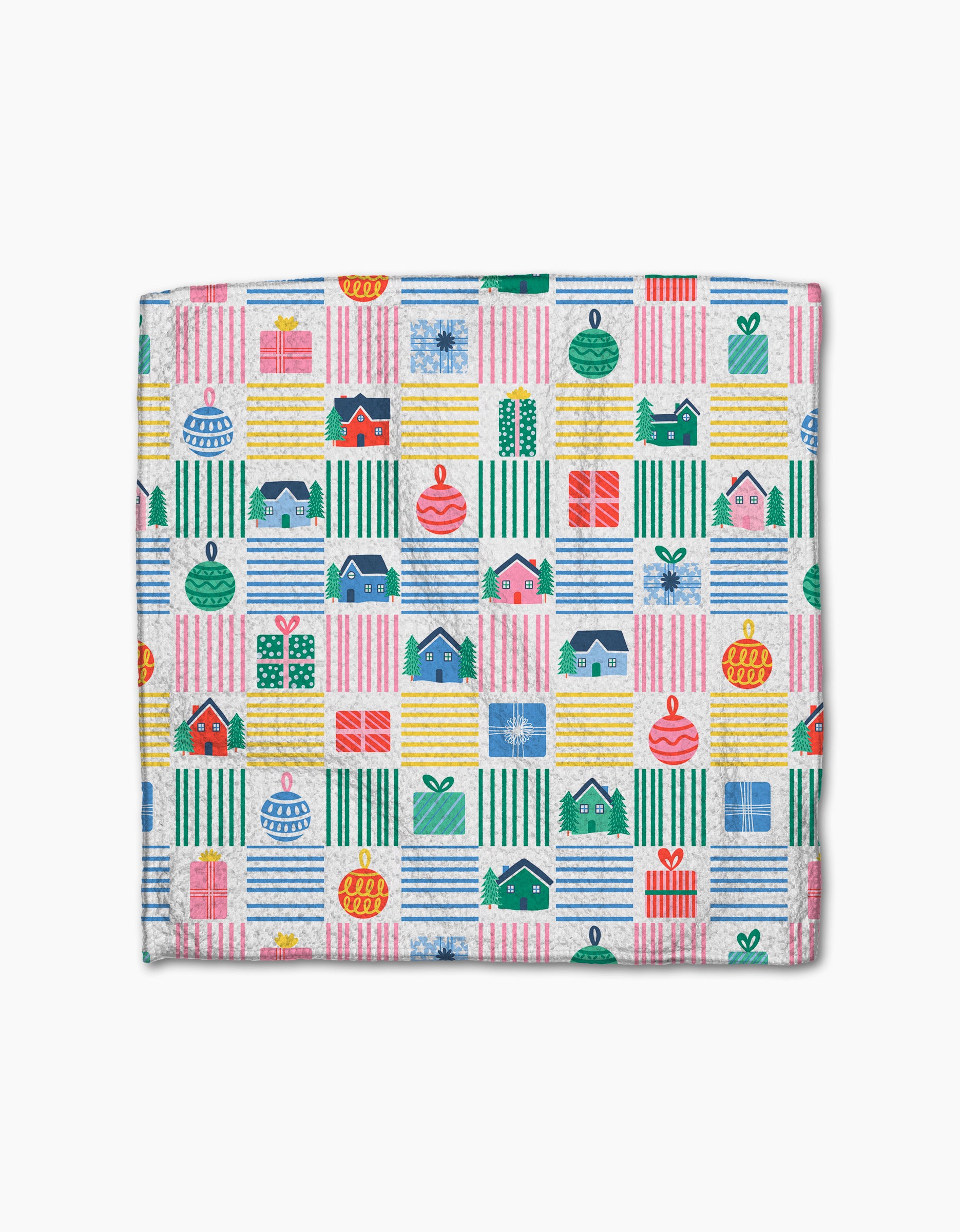 The Ceyda Alasar "Holiday Checkered" dish towel is folded and features a colorful, festive pattern of houses, presents, ornaments, and striped blocks in red, green, yellow, and blue on a white background.