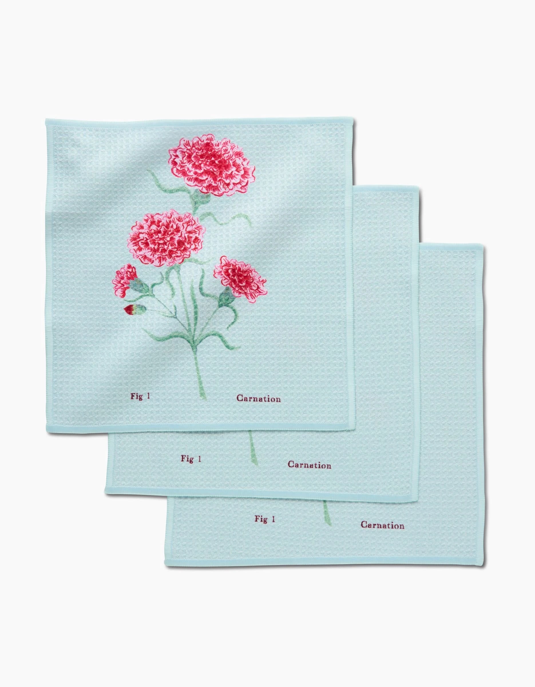 The Linda Fox January Carnation Dishcloth Set includes three light blue cloths with red carnation botanical illustrations, labeled Fig 1 and Carnation, made from super-absorbent Geoweave fabric.