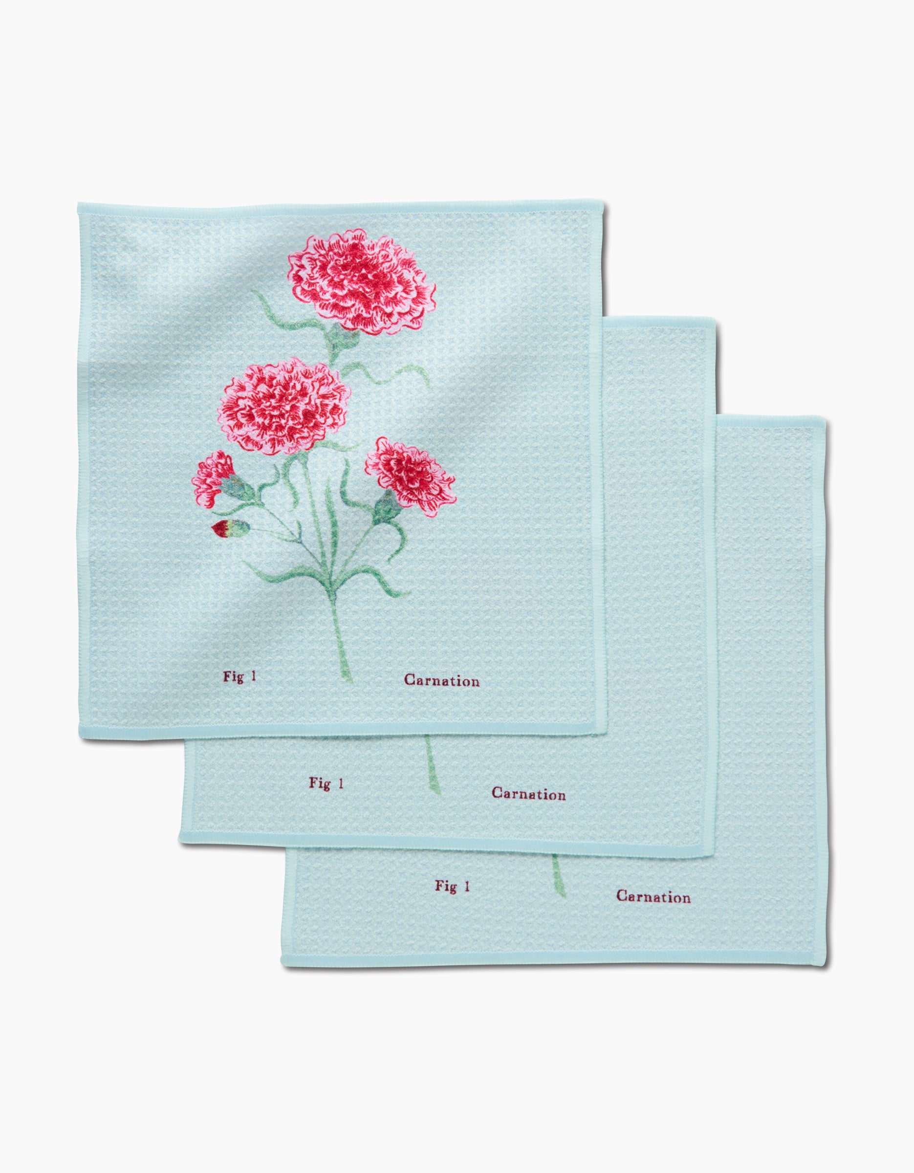 The Linda Fox January Carnation Dishcloth Set includes three light blue cloths with red carnation botanical illustrations, labeled Fig 1 and Carnation, made from super-absorbent Geoweave fabric.