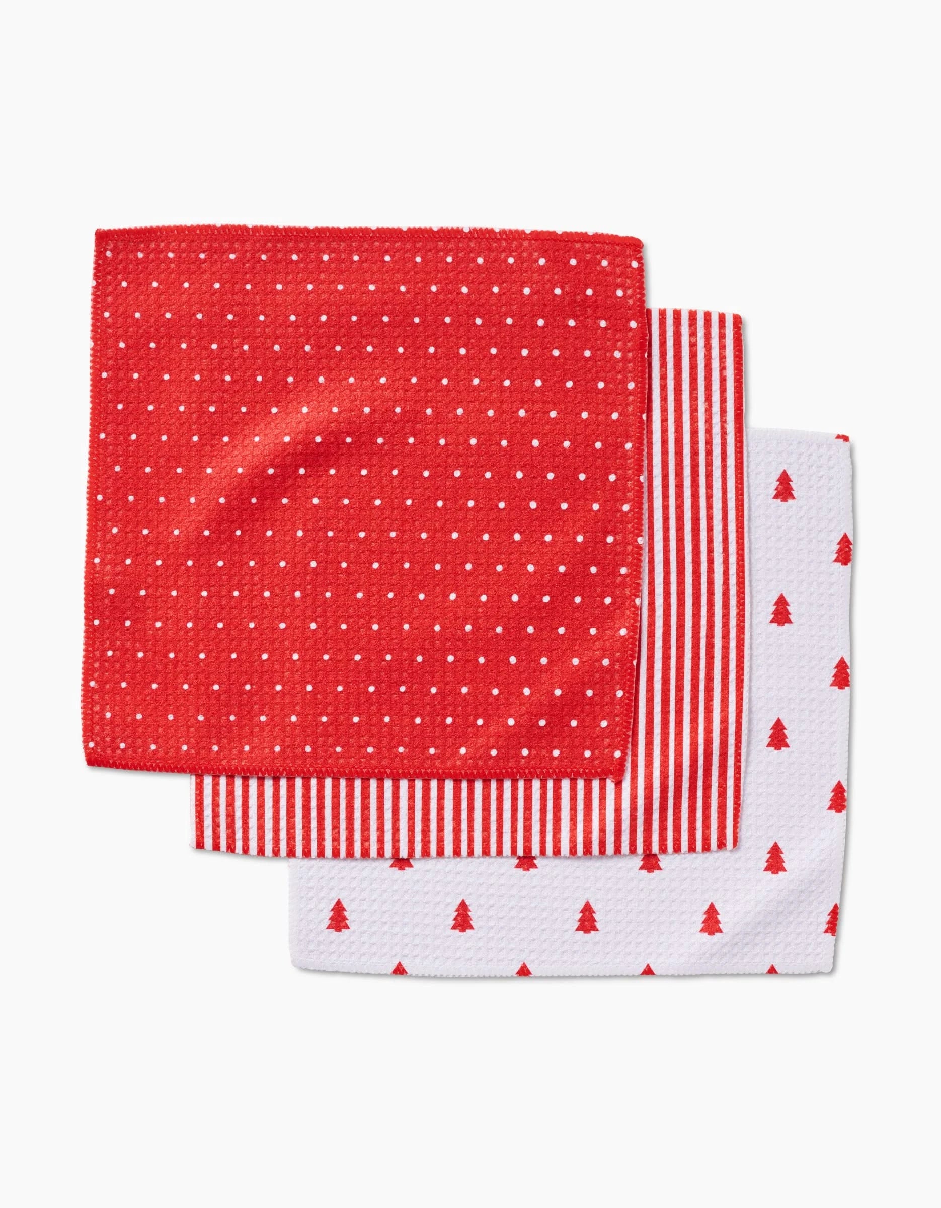 The Jolly dishcloth set by Kailee Wright features three super-absorbent Geoweave napkins: red with white dots, red and white stripes, and white with red Christmas tree patterns—perfect for festive holiday use.