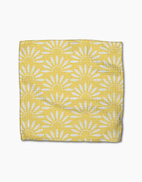The Ashley Celena Lemon Pop is a yellow, super-absorbent dishcloth with white sunburst or daisy patterns, neatly folded and displayed on a white background.