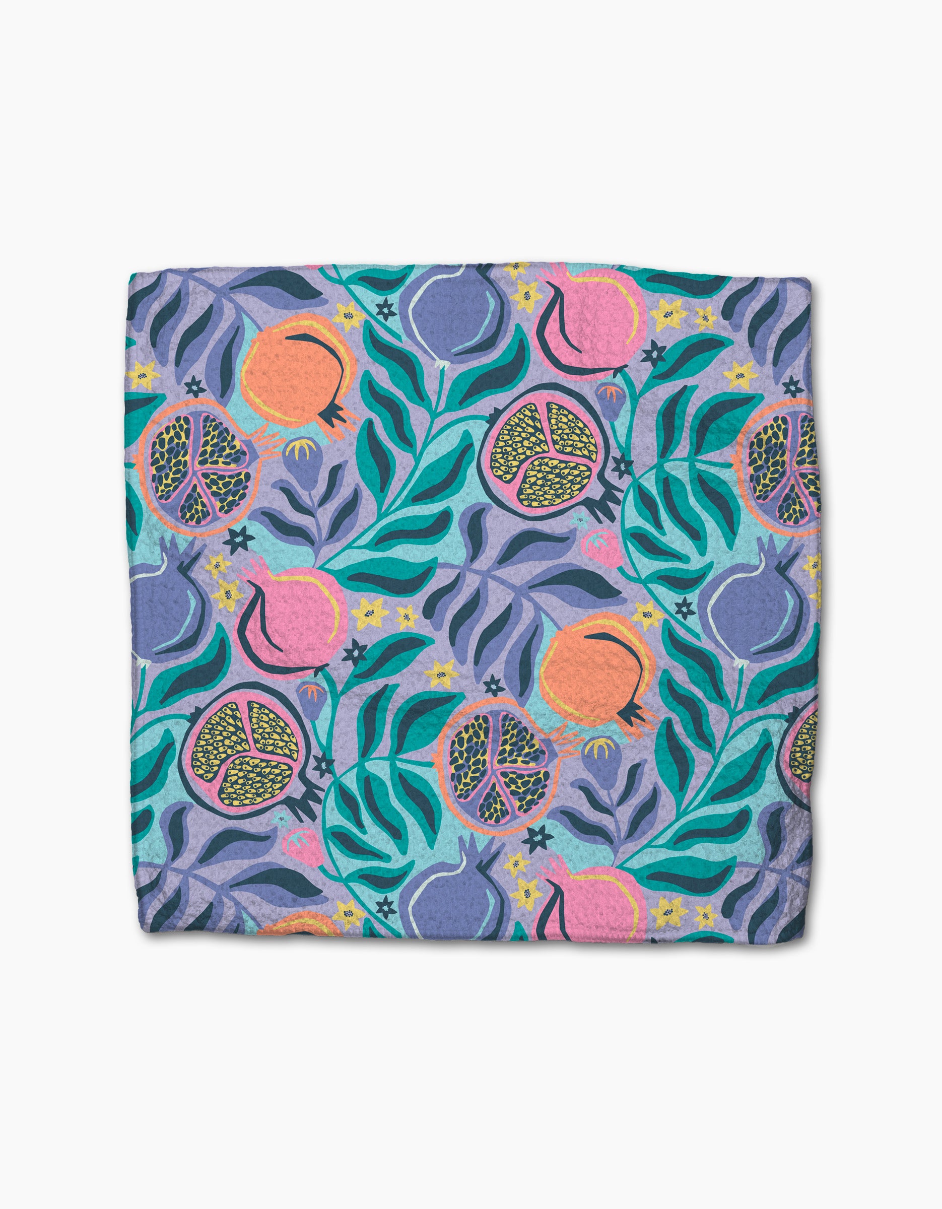 The Lucky Pomegranate dishcloth by Masha Volnova features a folded, absorbent design with vibrant pomegranates, seeds, and green leaves on a blue and purple background.
