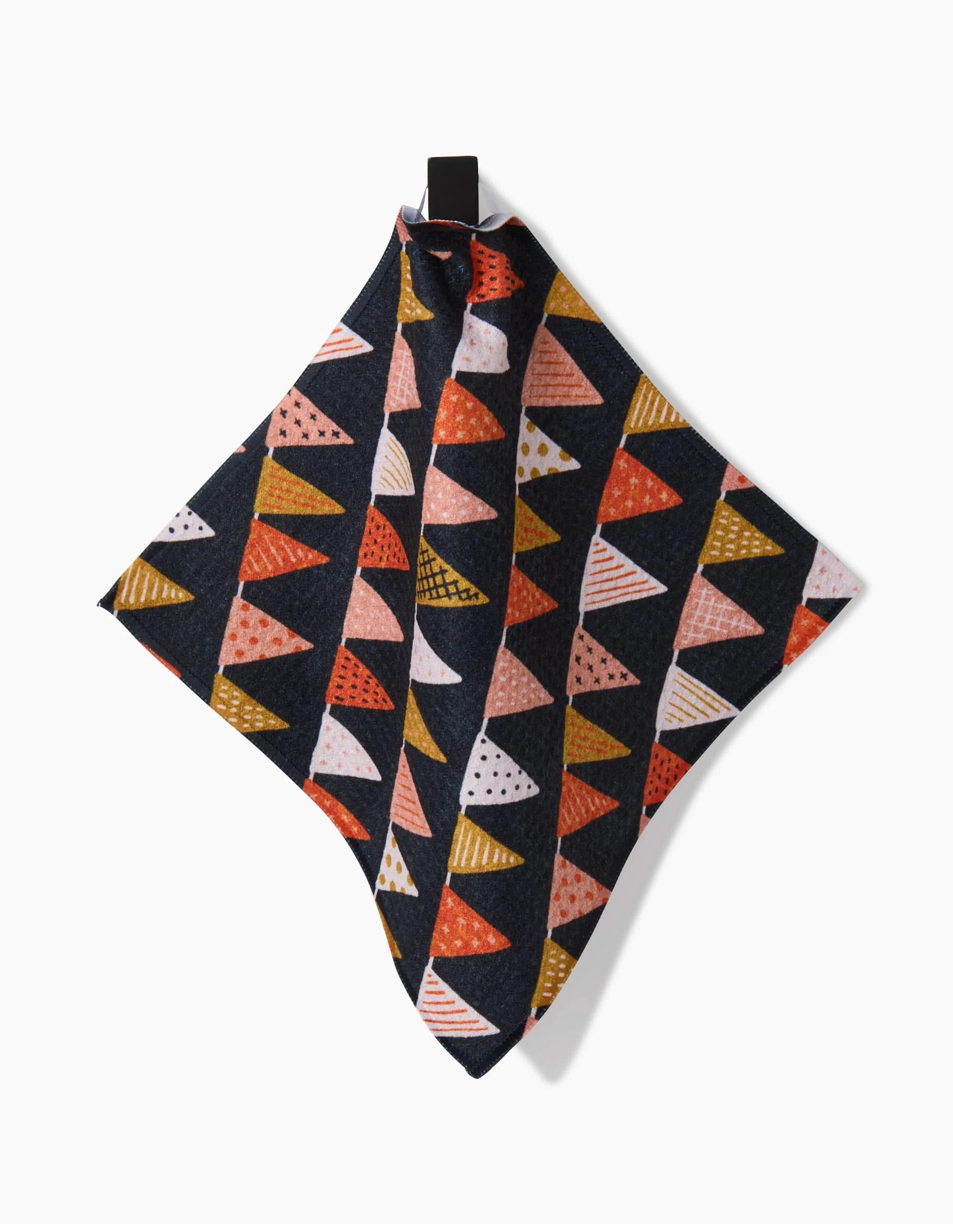The Morticia Edwina And Morrigan dish towel by Amy MacCready features colorful red, pink, orange, and yellow triangles on a dark background, made from recycled materials and hangs from a black loop.
