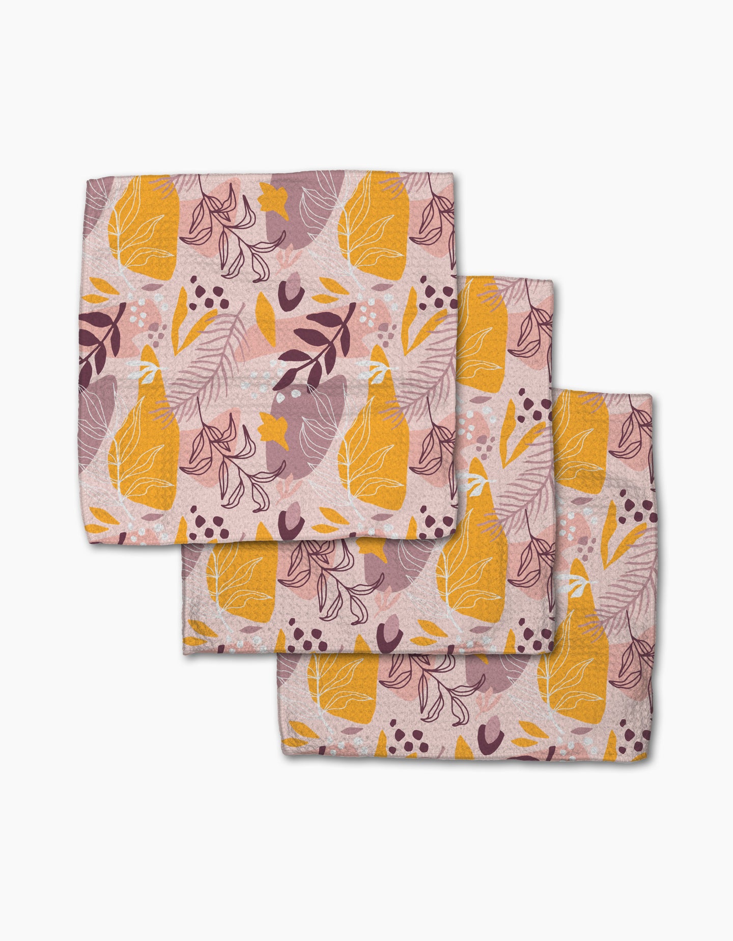 Nature Sketch cloth napkins by Cottonflower Studio—set of three, crafted from recycled materials—feature an abstract pink background with yellow pears, purple leaves, and scattered dots and shapes.