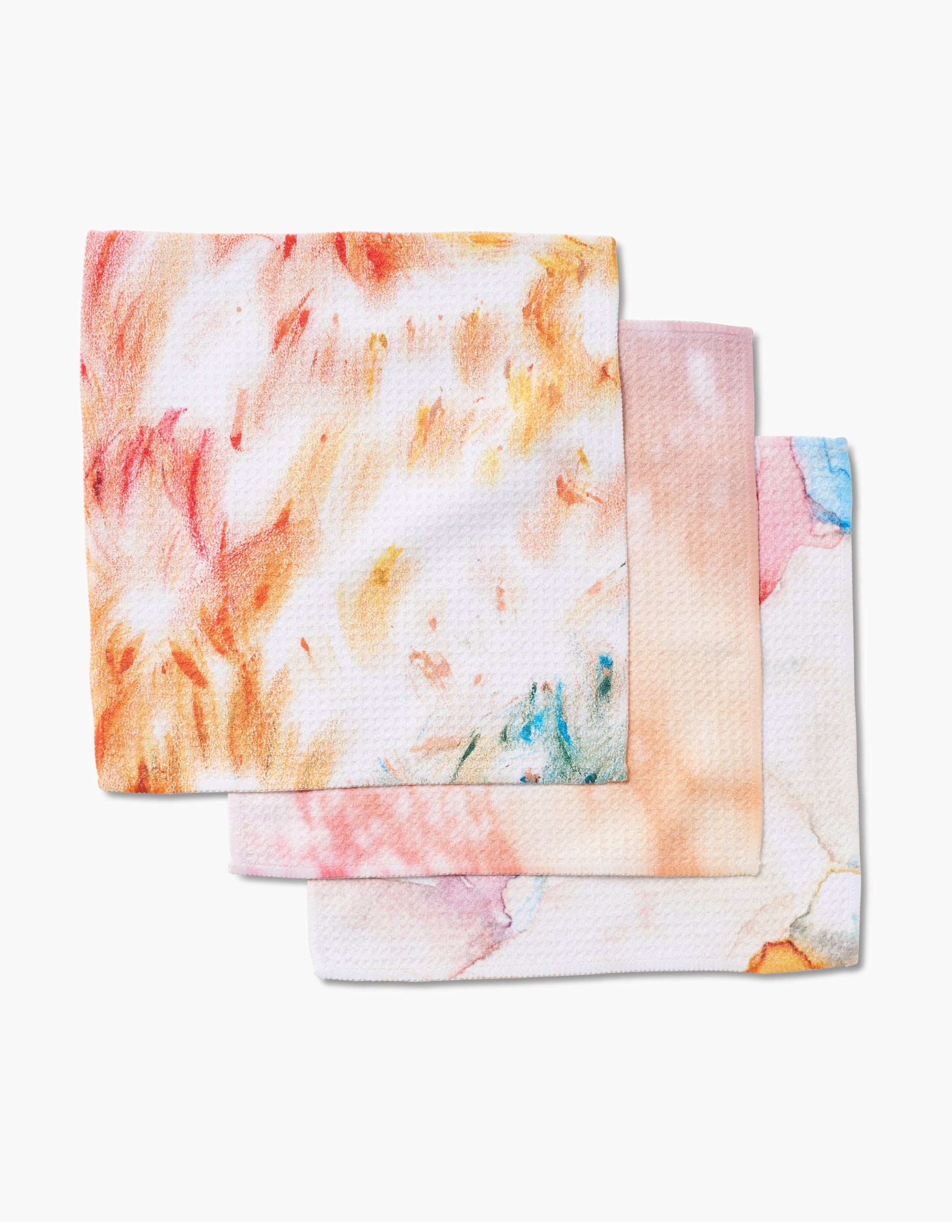 Three reusable Nice Water cleaning cloths by GEOMETRY are stacked, each with vibrant watercolor designs in orange, pink, yellow, blue, and green on white. Made from premium Geoweave fabric for enhanced durability.