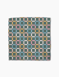 Park Lane by Charlie Rowan Designs features a geometric checkerboard quilt in teal, yellow, pink, white, and light blue on white. Made from ultra-absorbent Geoweave fabric, its symmetrical grid pattern spans the entire surface.