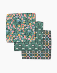 Three folded Park Lane cloth napkins by Charlie Rowan Designs, made from super-absorbent Geoweave: top shows colorful birds and flowers on dark, middle is green with white floral motifs, bottom has a pastel geometric checkered design.