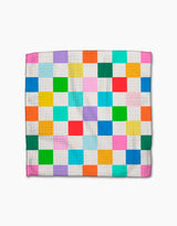 The Party Pop quilt by Vaishali Design Studio showcases a vibrant grid of colorful squares on white, crafted from eco-friendly Geoweave fabric. Displayed flat against a white surface.