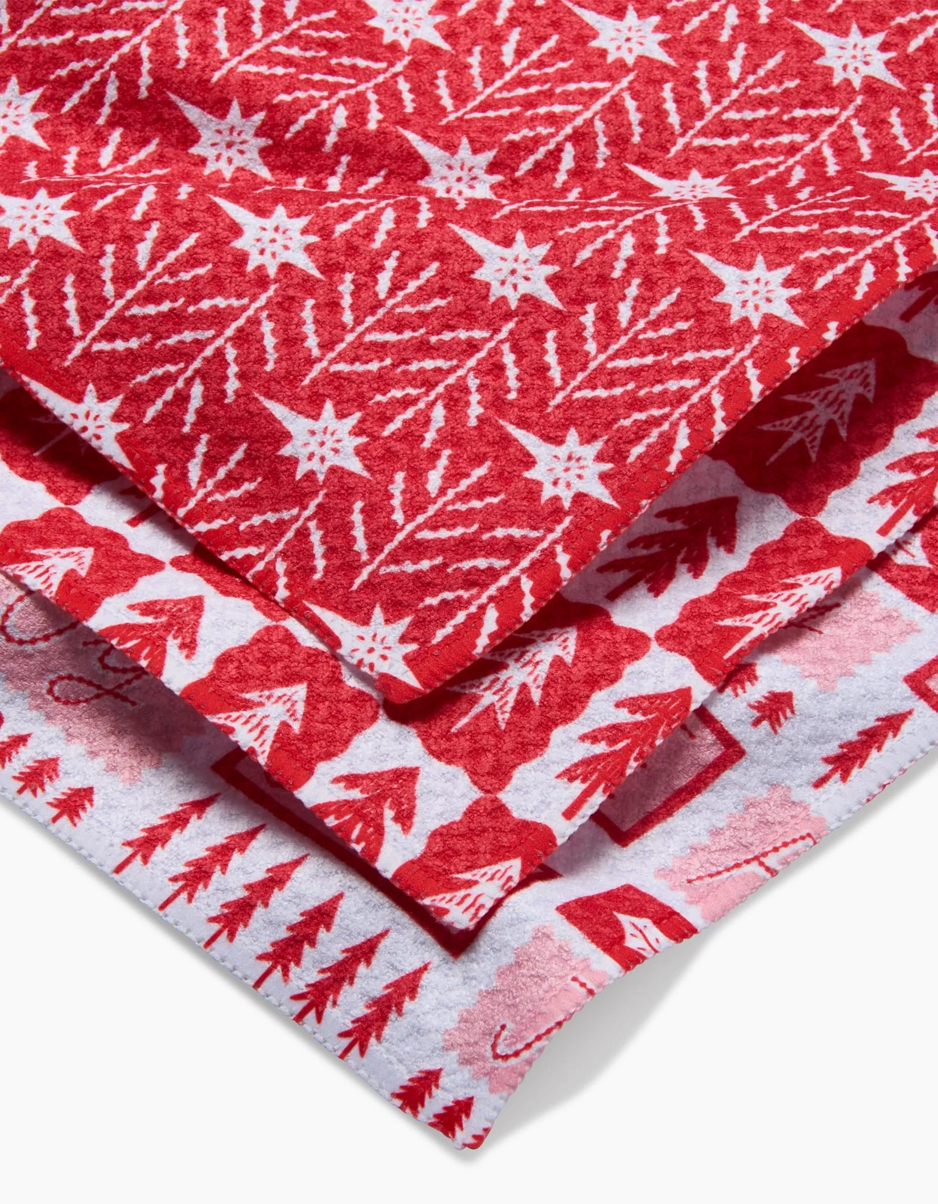 The Peace And Love To All by Roxy Marj features three stacked red and white holiday fabrics with Christmas trees, stars, snowflakes, reindeer, and candy canes, all crafted using Geoweave technology.