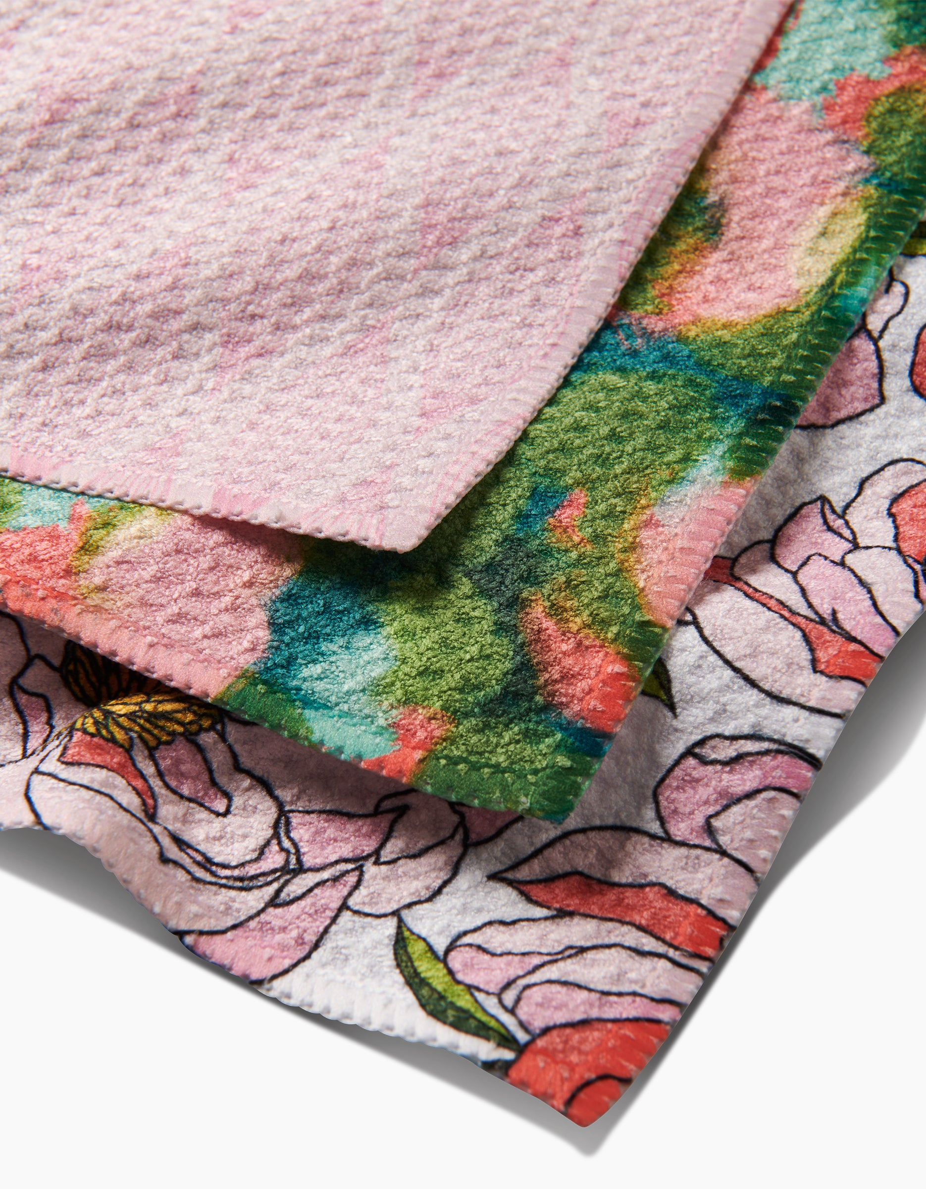 Peony Paradise dishcloths by Shelley Smith: three overlapping designs—a light pink textured top, a colorful tie-dye middle, and a floral bottom with pink flowers and black outlines.