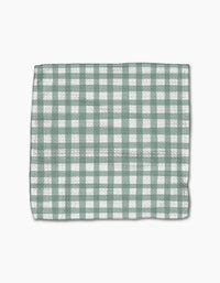 The Picnic Gingham dishcloth by Hufton Studio, featuring a green and white checkered pattern, is laid flat on a white background.